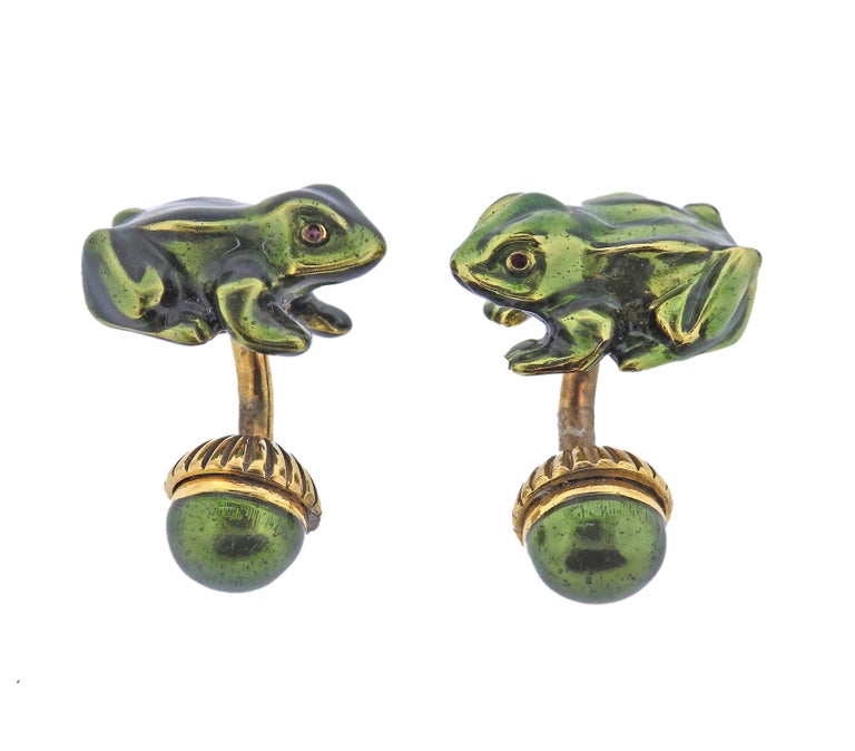 Pair of vintage 18k gold frog cufflinks by David Webb, adorned with red enamel eyes and green body. Come in original David Webb box. Each frog measures 22mm x 16mm, back ball is 11mm in diameter. Marked: Webb, 18k. Weight - 26.1 grams.
