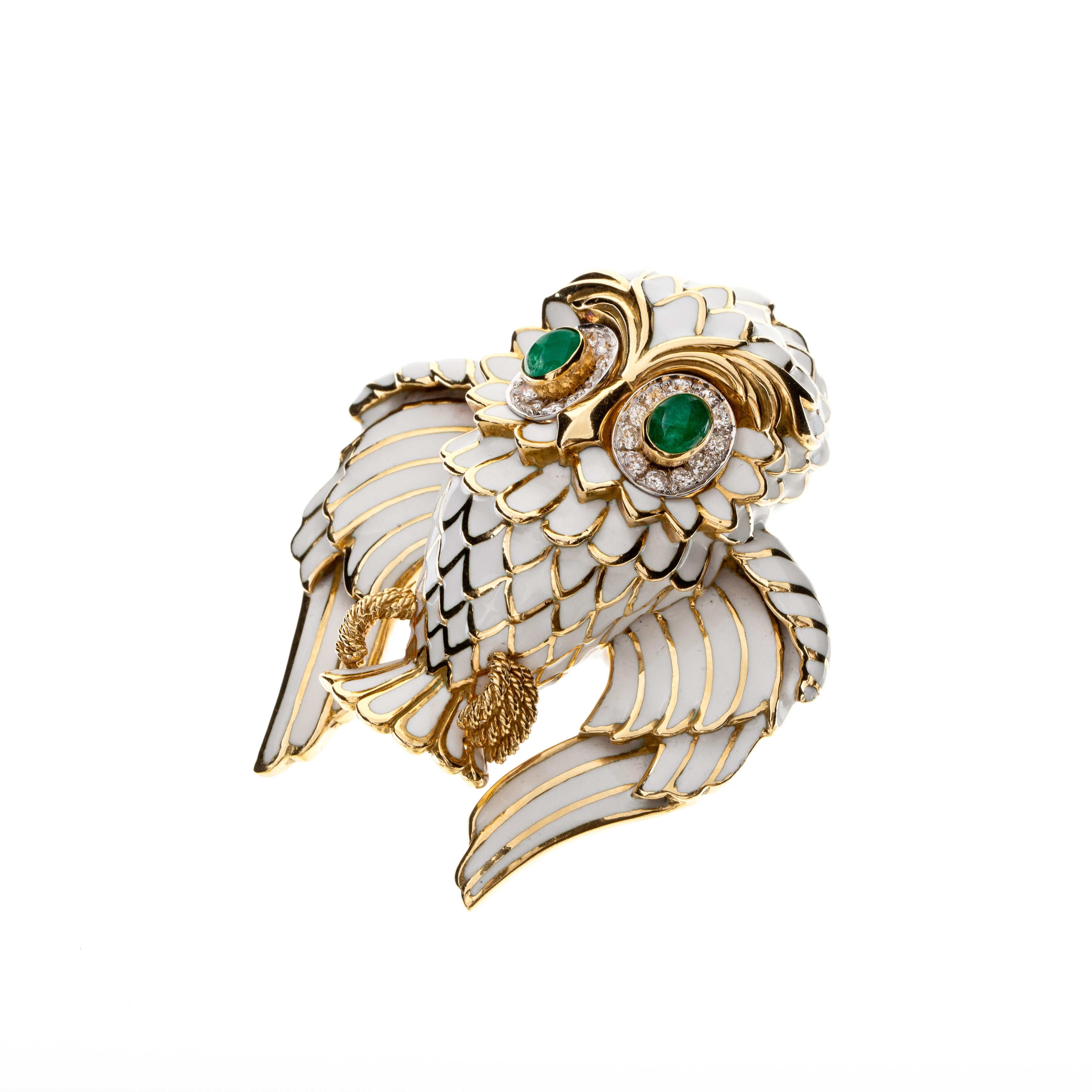 David Webb owl brooch in 18K yellow gold and platinum with white enamel, diamonds and emeralds.  It is marked 