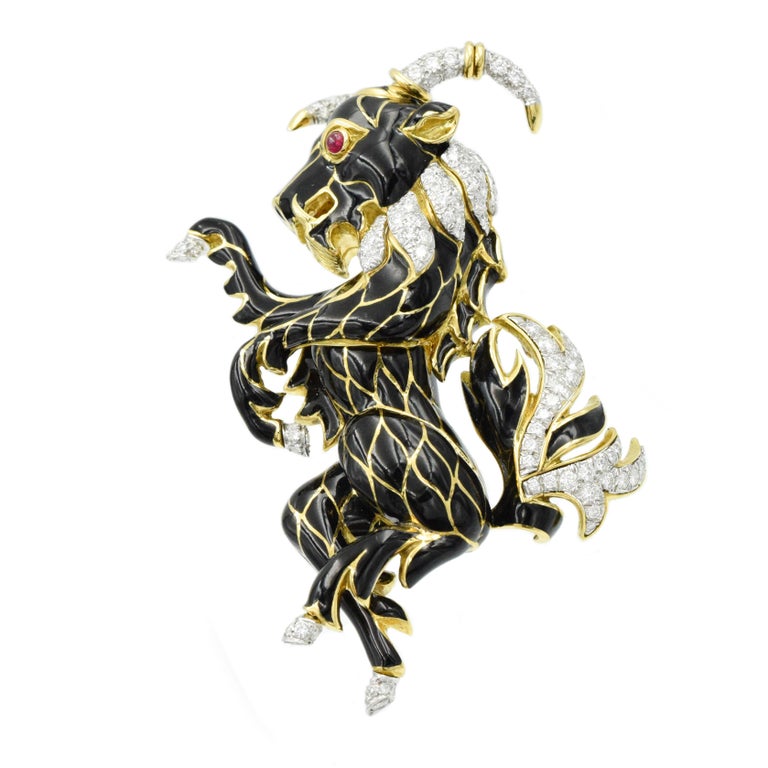 David Webb black enamel and diamond brooch with 127 diamonds encrusted in 18k gold horns, hooves and mane tail of this whimsical ram/goat. Estimated total weight of the diamonds is 4 carats with  2  ruby eyes.
Signed: David Webb