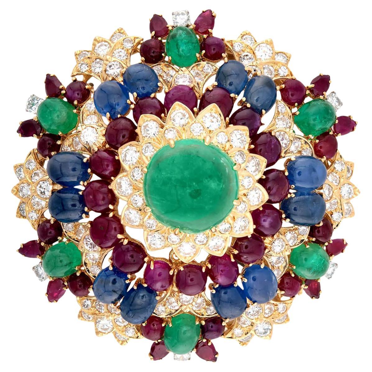 DAVID WEBB Estate 18k Emerald, Diamond, Sapphire, and Ruby Starburst Brooch (Broche en étoile en émeraude, diamant, saphir et rubis)
