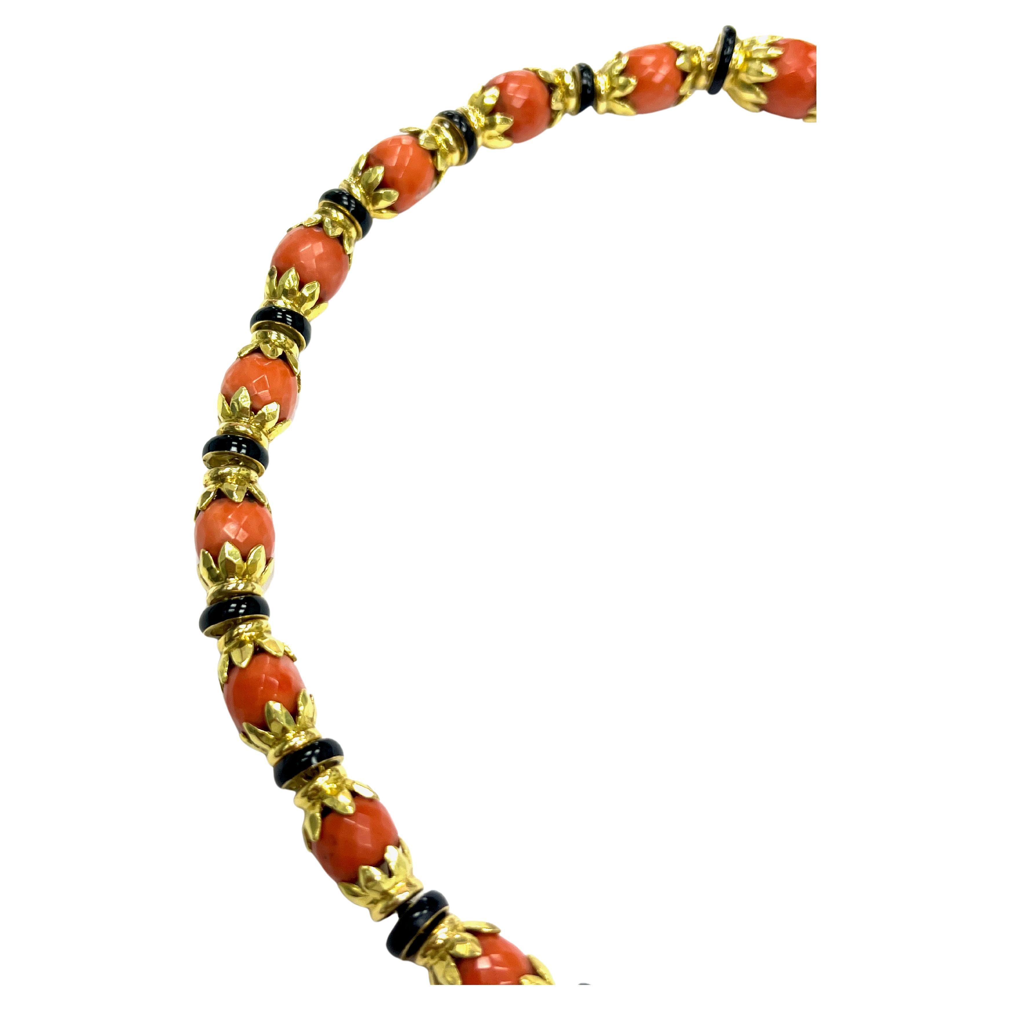 David Webb Faceted Coral Black Onyx 18k Yellow Gold Necklace

A collar necklace made of twenty faceted coral beads, twenty-one black onyx-lined discs, and 18 karat yellow gold; marked Webb, 18k

This necklace can be separated into two parts that can