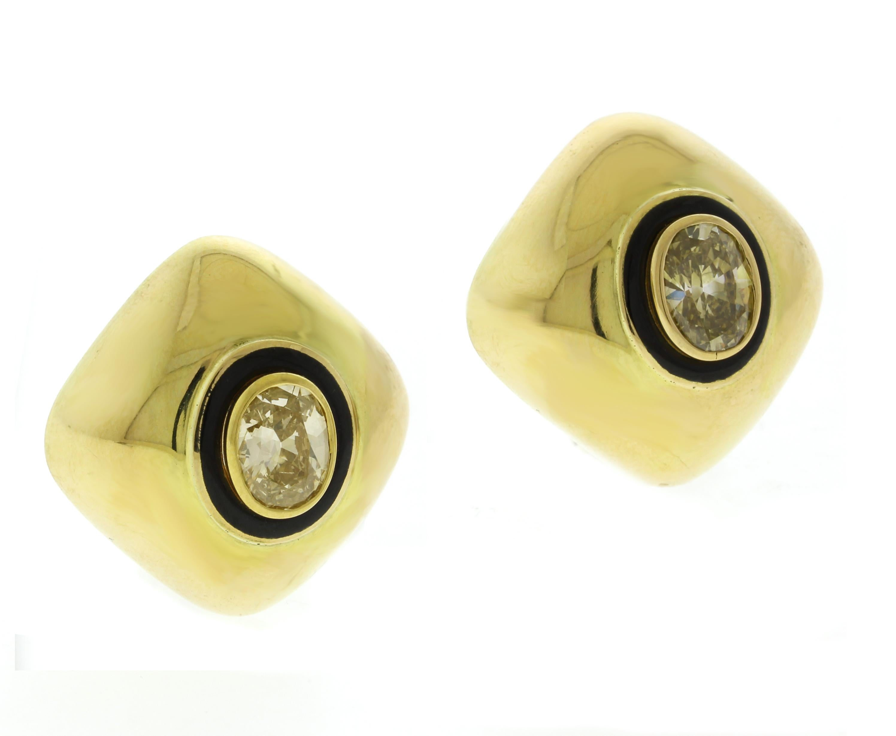 From the renowned designer David Webb, this exquisite pair of earrings showcases two natural fancy-colored diamonds, each weighing approximately 1 carat. One diamond radiates a vibrant canary yellow hue, while the other features a rare and