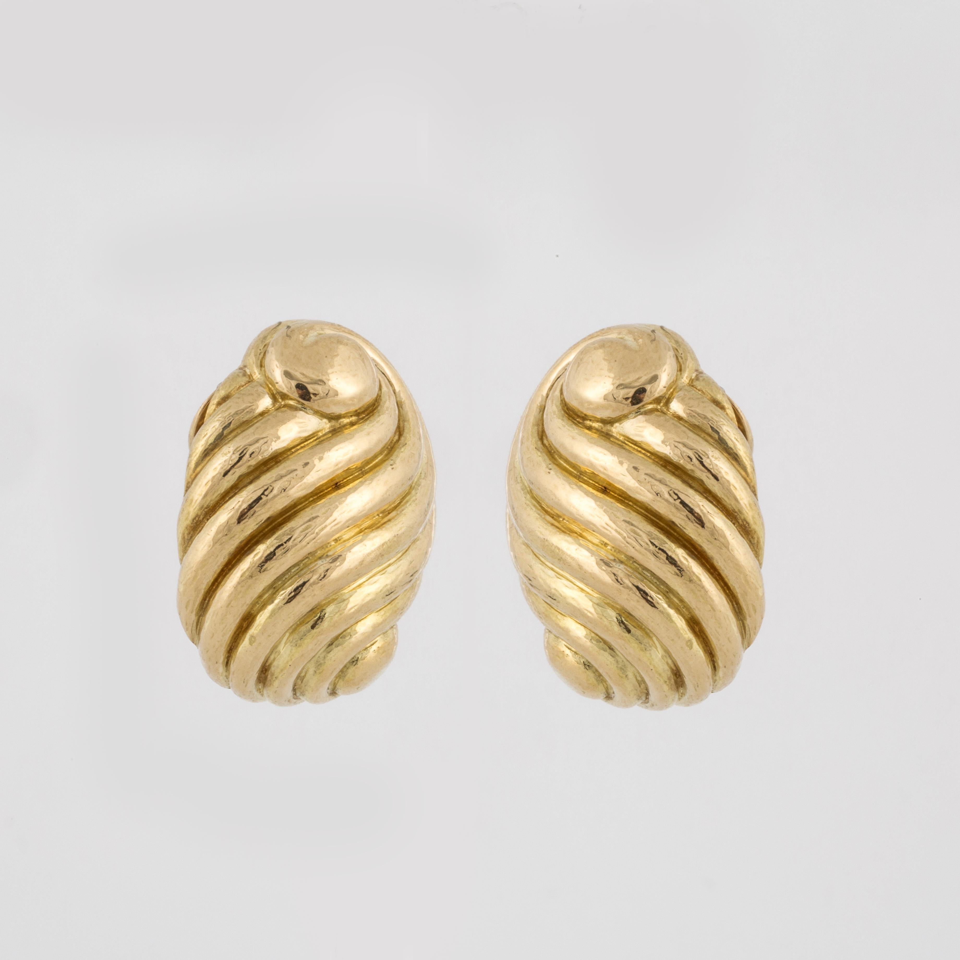 David Webb earrings composed of 18K yellow gold in a fluted swirl design.  The earrings are marked 