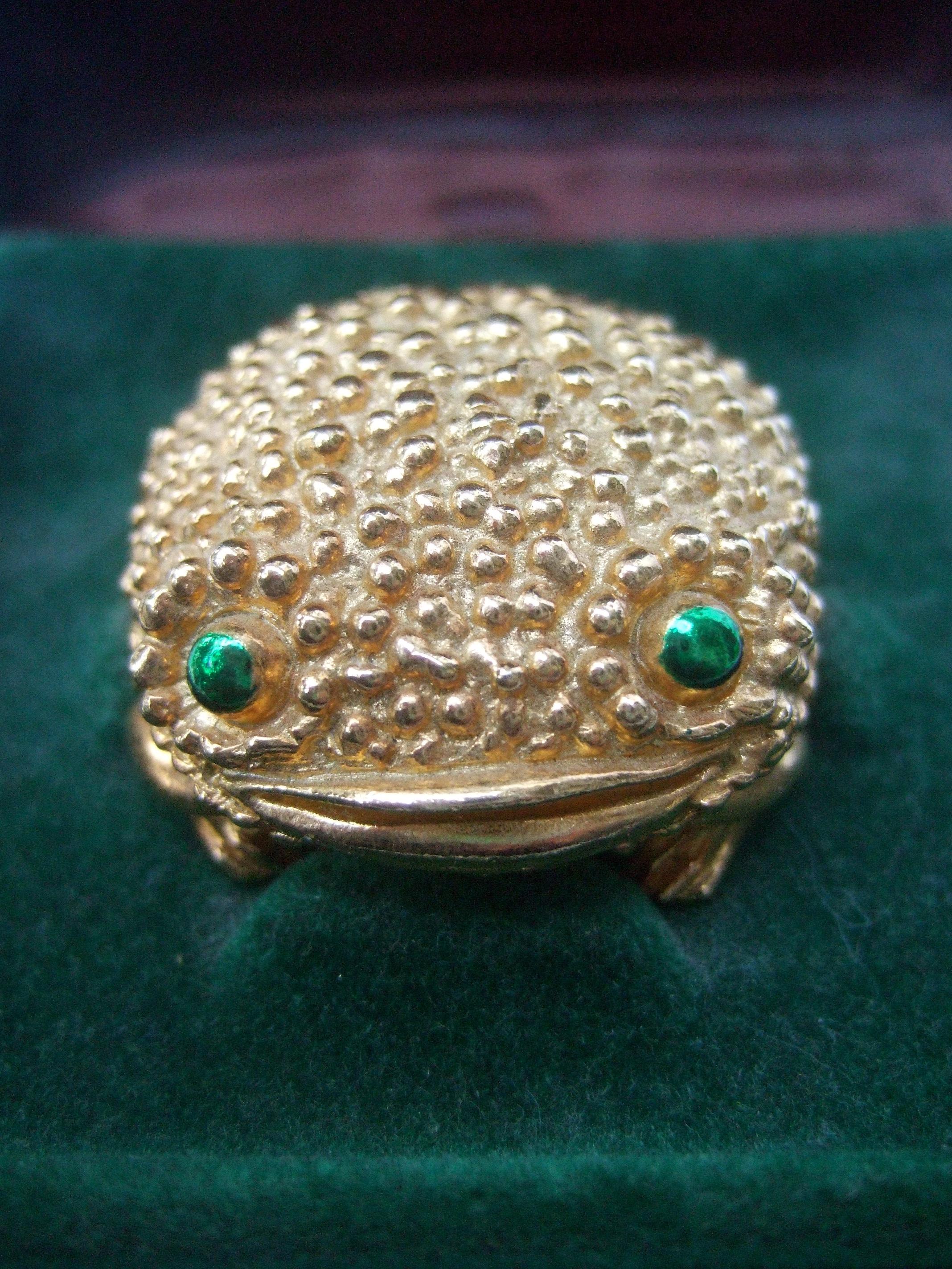 David Webb for Revlon costume frog wax perfume container in the original presentation box c 1970s
David Webb collaborated with Revlon & created a series of costume animal wax fragrance creatures 
The endearing gilt metal costume frog has textured