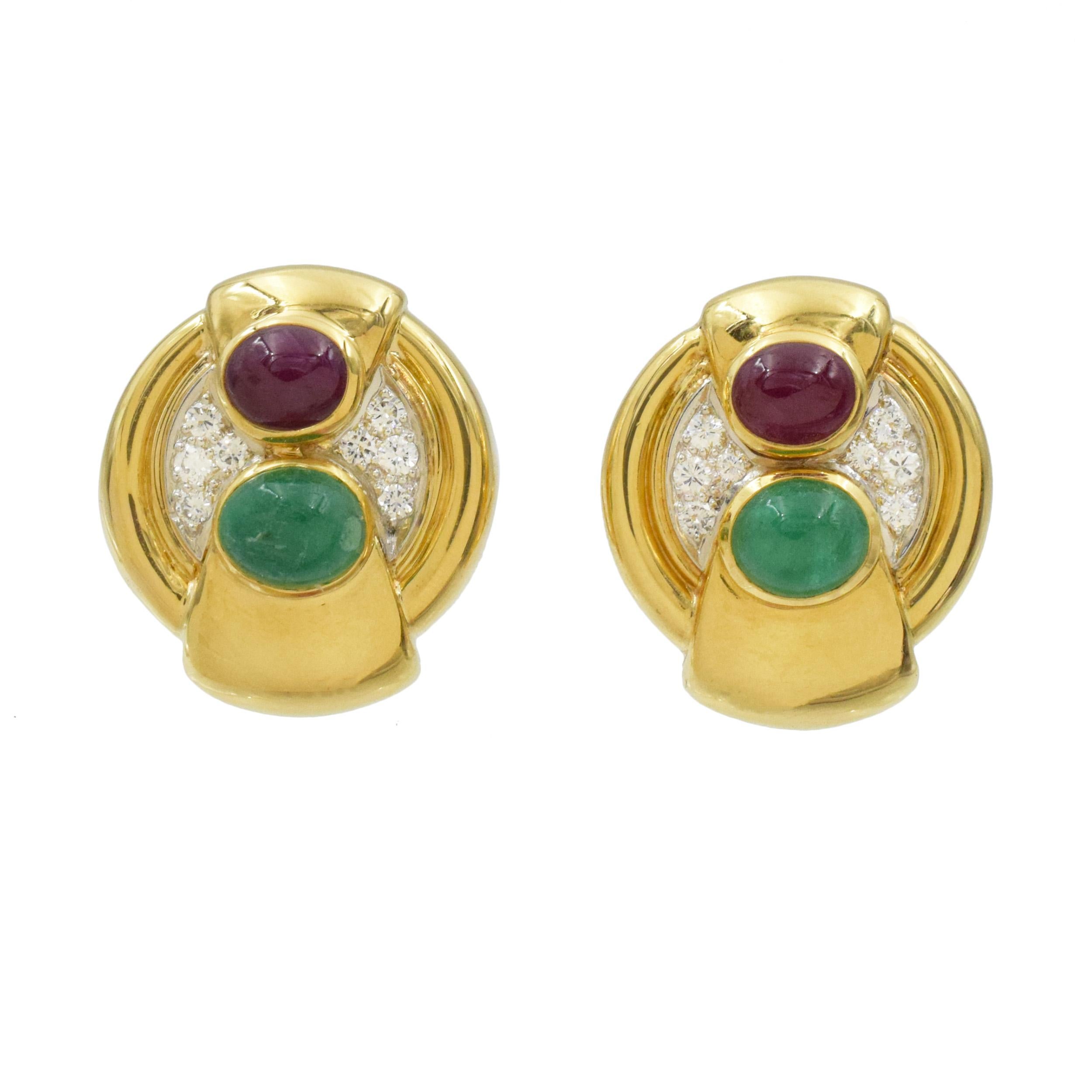 David Webb Gemstone and Diamond Earrings This pair of earrings has 2 cabochon
rubies (2.5 carats total carat weight) and 2 cabochon emeralds (3 carats total carat weight) bezel set in 18k yellow gold along with 16 round diamonds (0.16 carats total