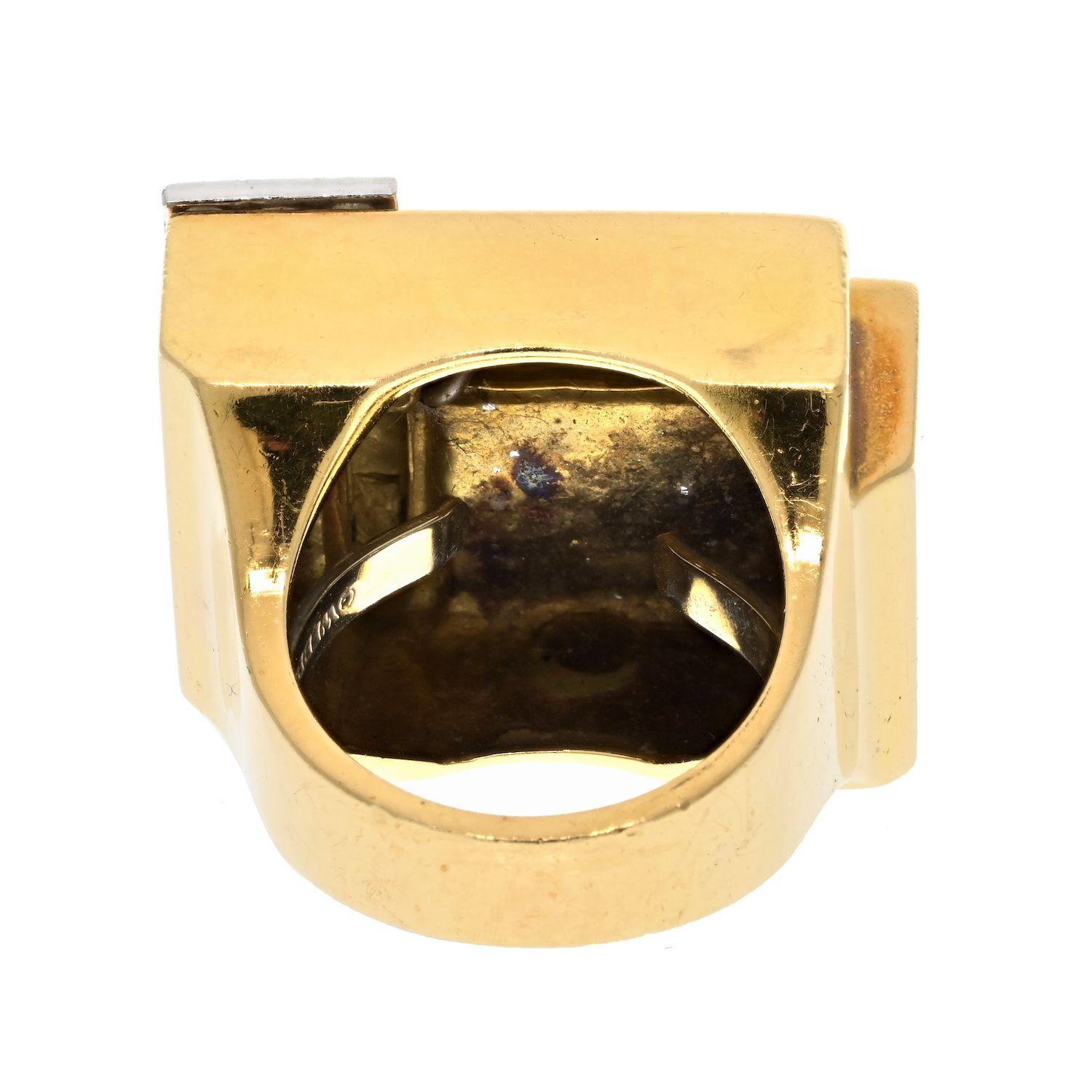 Owning this David Webb ring is truly exciting! The platinum, 18K yellow gold, and white enamel create a stunning and unique look that can't be matched. This is a geometric free form cocktail ring by David Webb that makes a statement. When diamonds