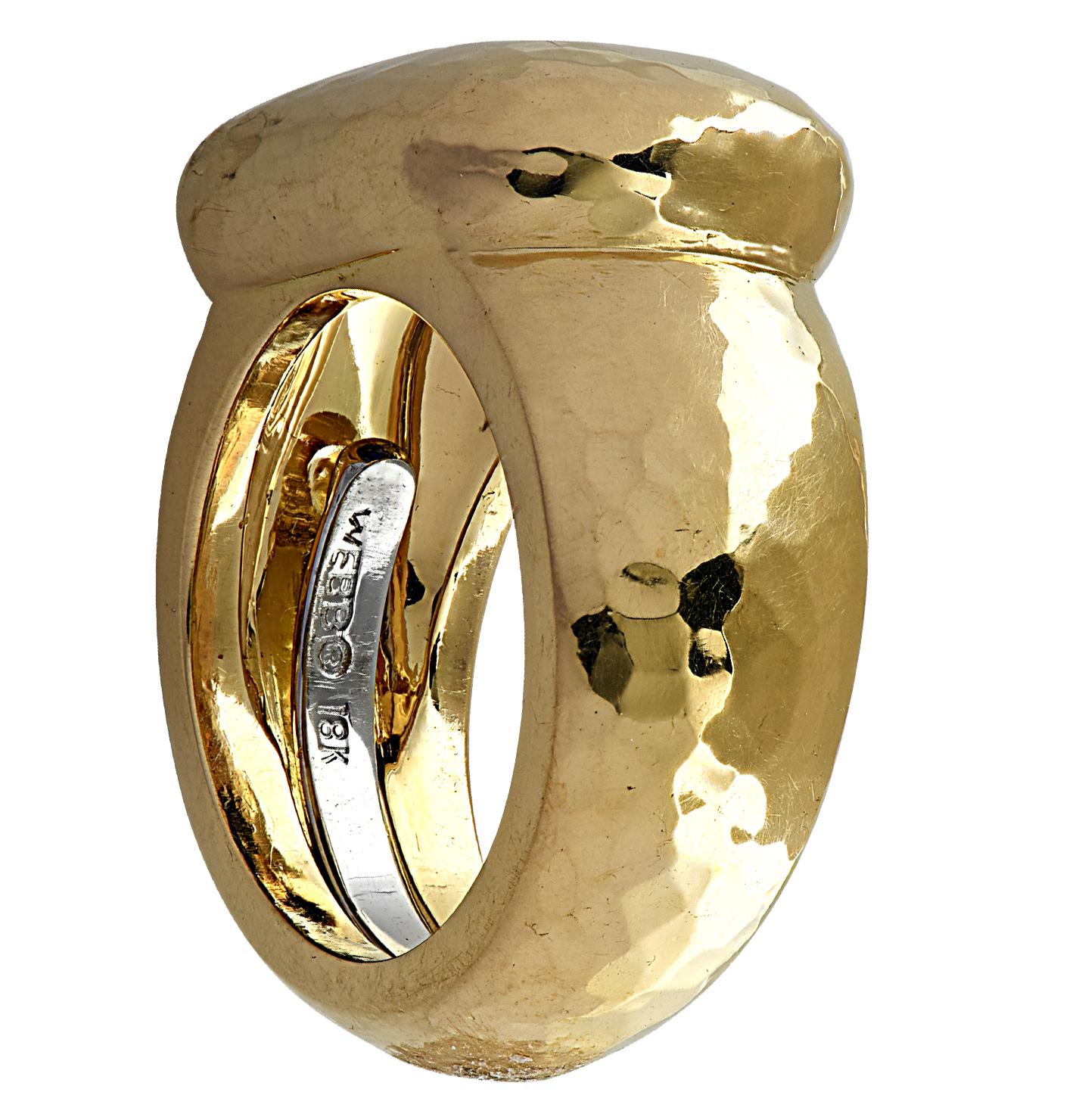 David Webb Sapphire ring crafted in 18 karat gold showcasing a spectacular GIA certified octagonal step cut Sapphire weighing 3.61 carats with no indications of heating. The stunning blue sapphire is bezel set east-west in a hammered yellow gold