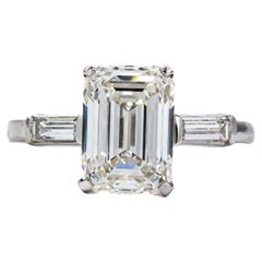 David Webb GIA Certified 5.01 Carat F VS1 Emerald Cut Diamond Three Stone Ring