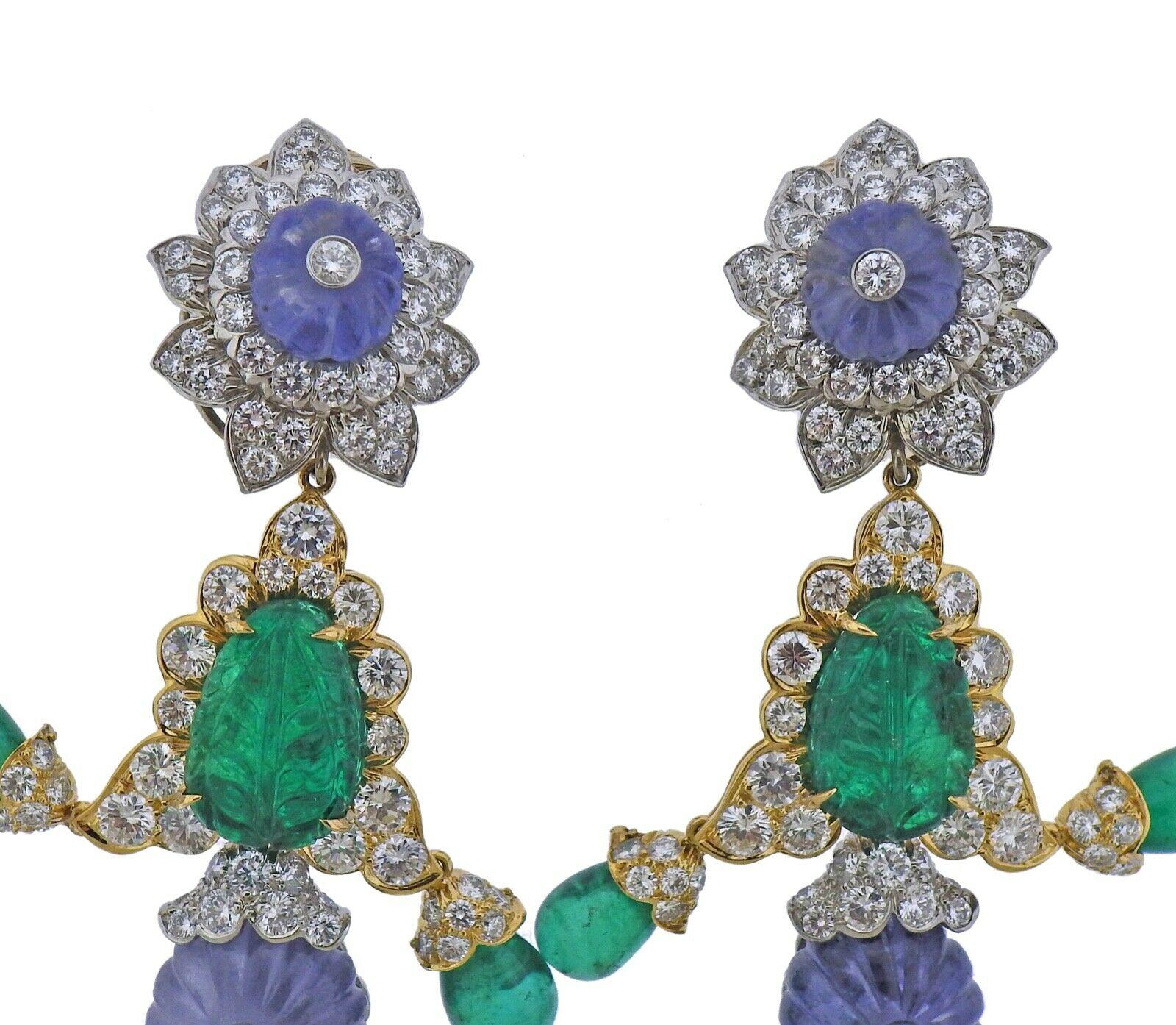 18k yellow gold and platinum drop earrings by David Webb. Set with approx. 5.50ctw of G/VS diamonds, carved sapphire and emeralds. Earrings measure 97mm x 28mm at widest point. Two detachable drops can convert earrings to be 65mm long or 22mm.