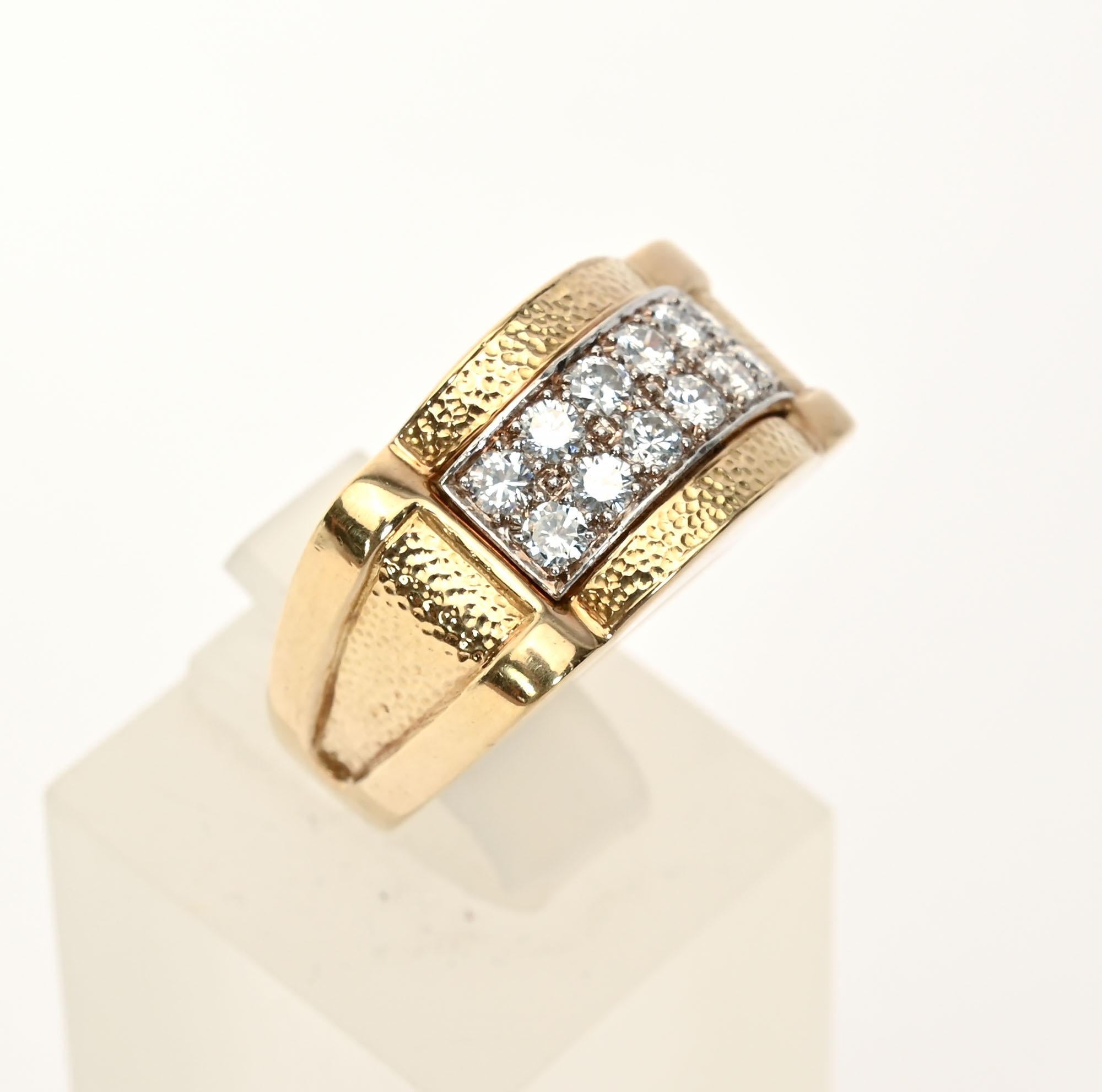 David Webb 18 karat gold ring with 12 diamonds set in platinum. Hammered surfaces on top and sides with smooth finish front and back. Size 6 1/4 but can be sized up or down. Can be worn equally well by a man or woman. It measures 7/8