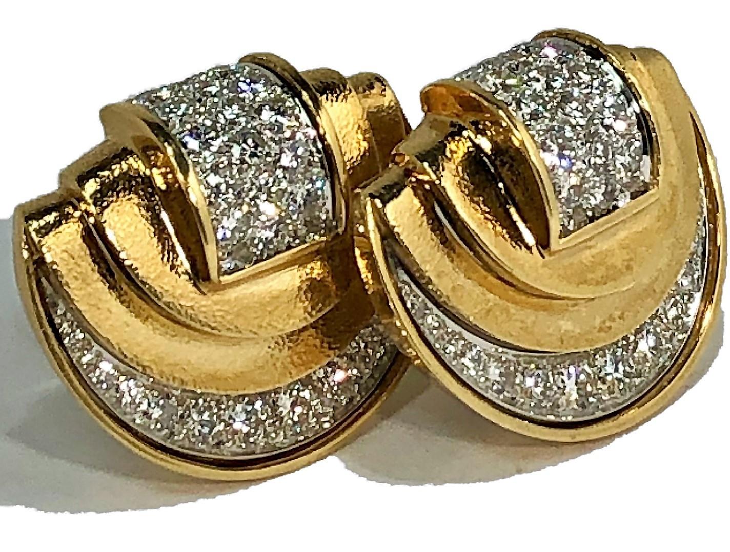 A pair of 18K yellow gold and platinum earrings, with a half moon outline, and a saddlebag design. Produced by David Webb, they measure 1 inch by 1 1/2 inches. Set with 68 round brilliant cut diamonds for a total approximate weight of 6.25ct, the