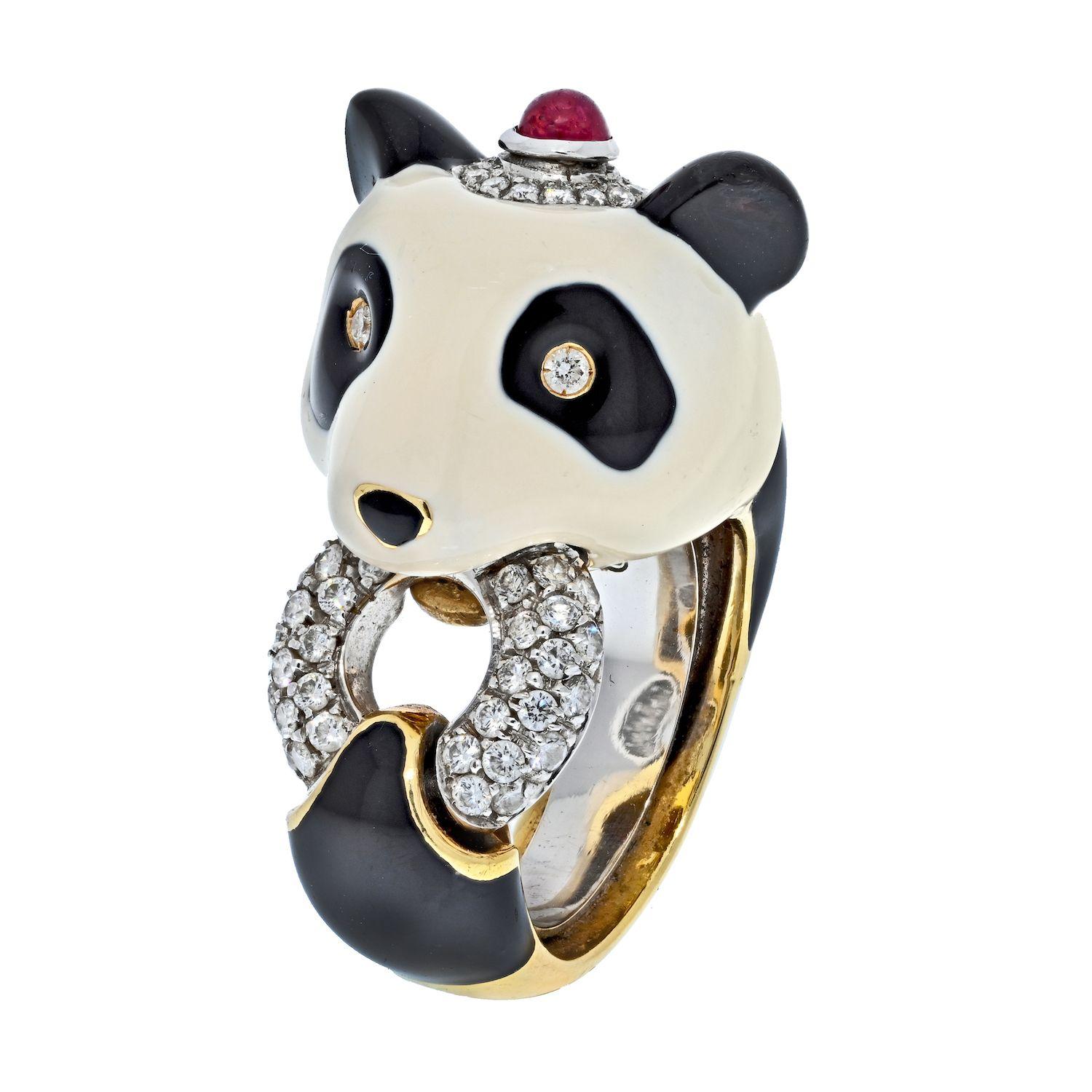 Very cute ring by david Webb. Made in 18kt. gold ring in a form of a Panda Bear in white and black enamel set with diamond eyes and diamond and a ruby cap and diamond connecting ring. Signed WEBB.
David Webb jewelry is characterized by big, bold