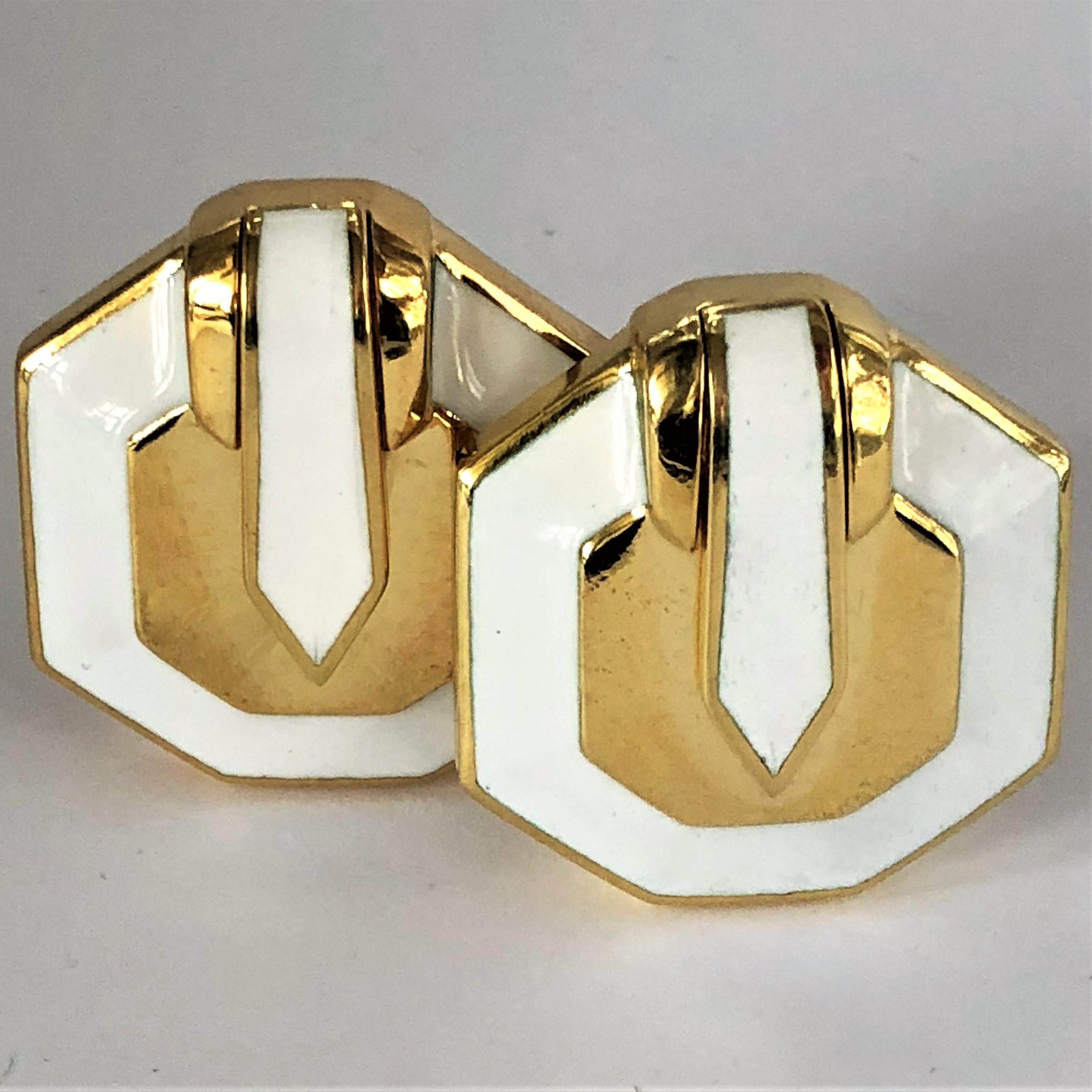 Great for summer! These octagonal shaped, White Enamel over 18K Yellow Gold
David Webb clip on earrings will compliment your summer white wardrobe.
Measuring 1 3/16 inch long by 1 1/8 inch wide, and weighing 42.2grams, these
good looking earrings