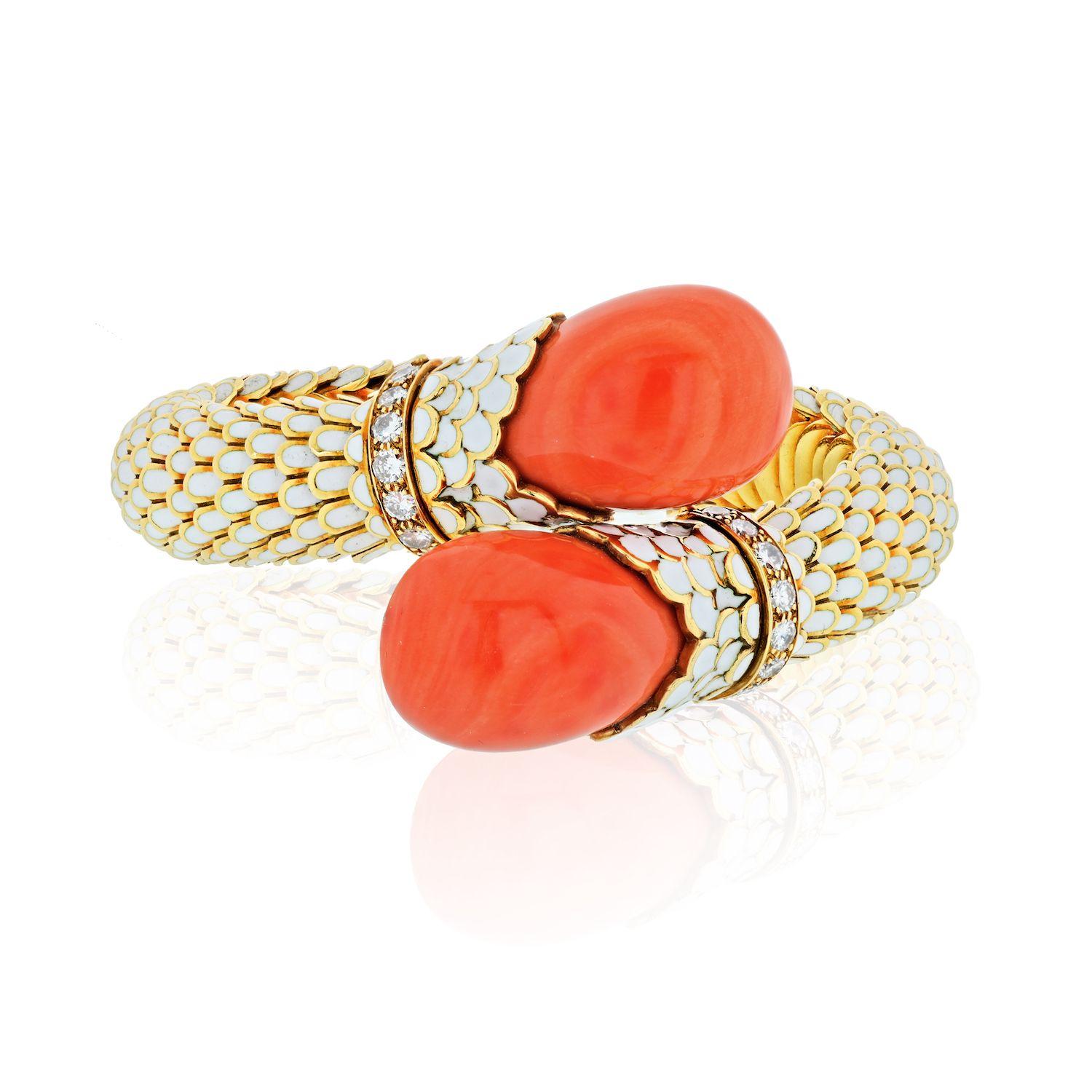 David Webb
Gold Coral Bypass Crossover White Enamel Diamond Bangle Circa 1965 Bracelet

A CORAL, ENAMEL AND DIAMOND BRACELET, BY DAVID WEBB

The flexible cross-over bangle designed as a series of scalloped links enhanced by white enamel and polished