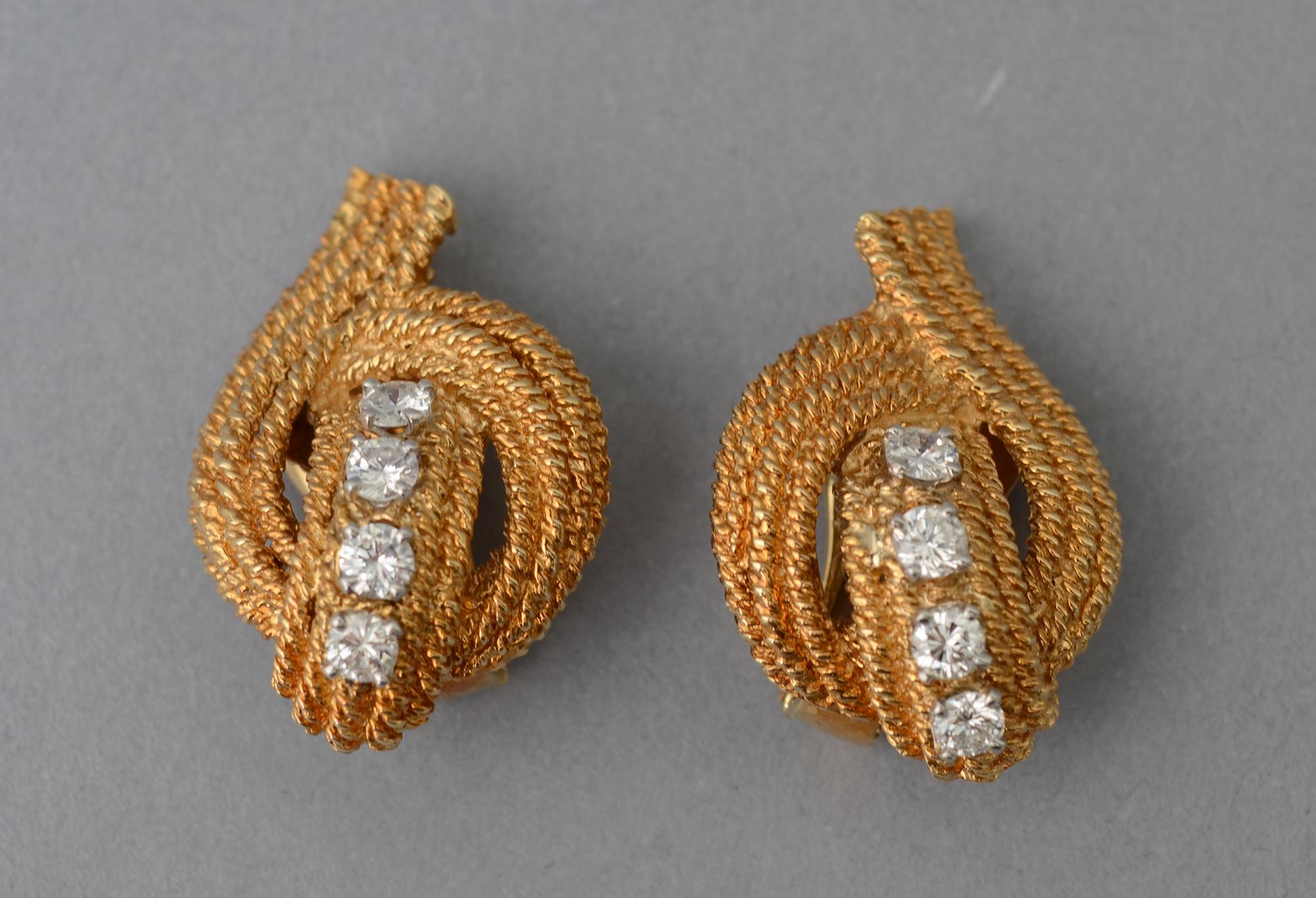Elegant gold and diamond ear clips by David Webb. Each earring has 4 diamonds with a total weight of approximately 1.25 carats. They are surrounded by three rows of twisted gold in a graceful, uplifting  design.
Clip backs can be converted to posts.