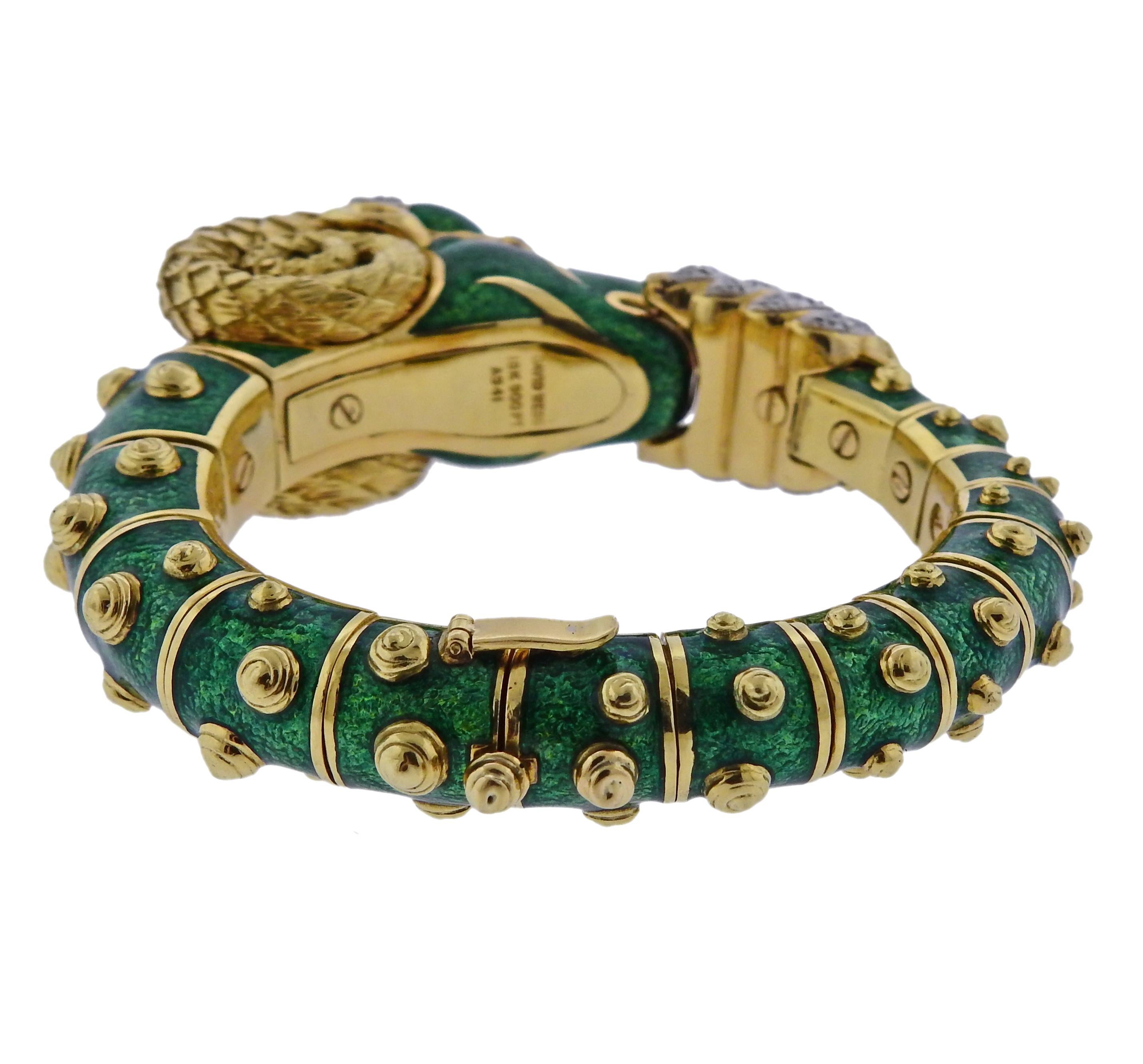 Iconic 18k gold, platinum and green enamel ram's head bracelet by David Webb, set with approx. 1.70ctw in VS/G diamonds and rubies. Bracelet will fit up to 7