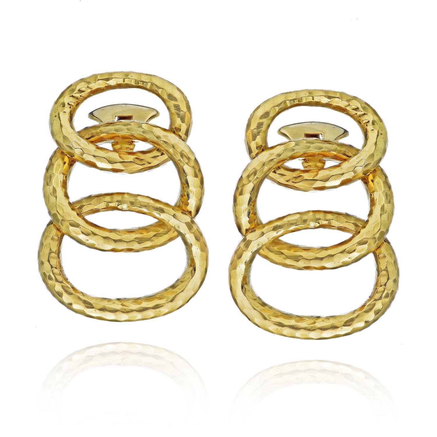 David Webb Yellow Gold Hammered Triple Hoop Earrings

Circa 2000 David Webb 18K Yellow Gold Triple Hoop Earrings with a Hand Hammered Finish. Measuring 1 5/8 inches in length and 1 1/8 inch wide. Each hoop is is individually attached for articulated