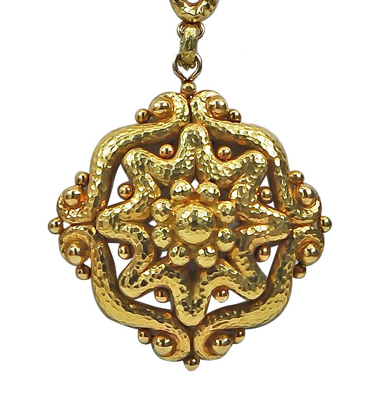 Designed as a long hammered link necklace suspending a stylized pendant, measuring 
approximately 174.2 dwt, this brilliant 18k gold David Webb piece can be easily transitioned from day-to-night, enhancing any outfit.
Signed David Webb