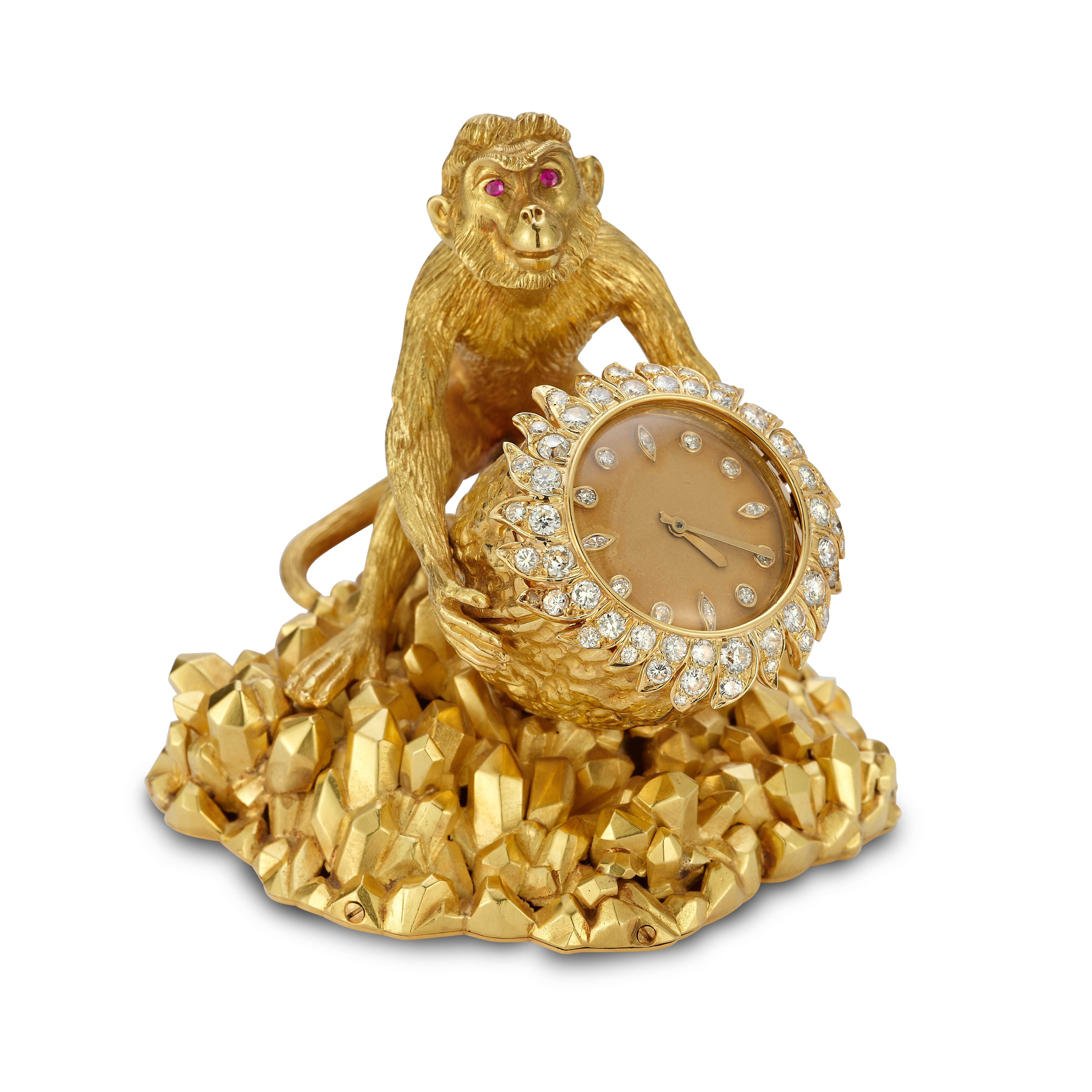 David Webb Monkey Desk Clock

An 18 karat yellow gold desk clock designed in the shape of a walnut, adorned with round and marquise cut diamonds. The clock is held by a monkey with round cut ruby eyes. The total weight of the diamonds is