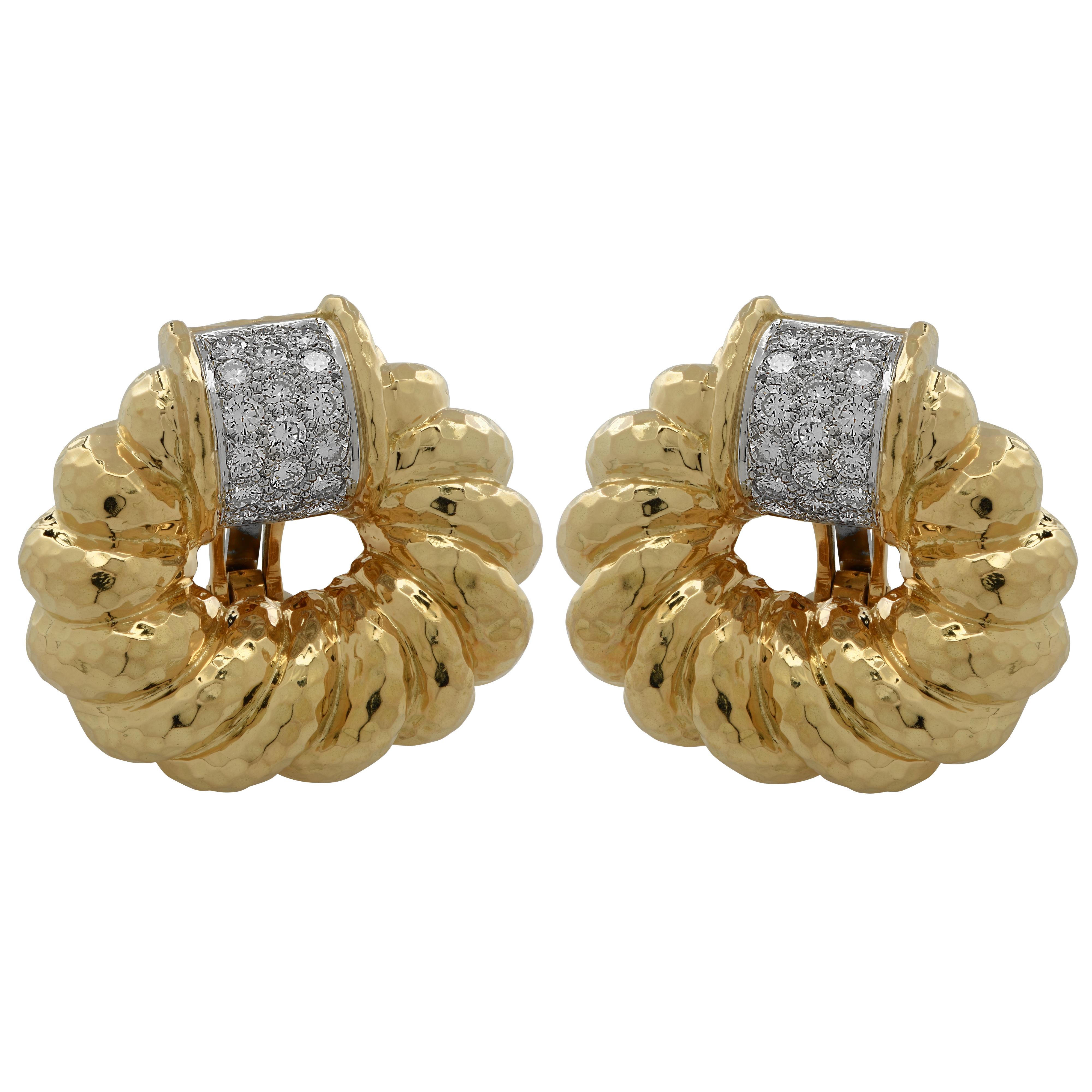 Sensational David Webb earrings crafted in platinum and 18 karat yellow gold, featuring 38 round brilliant cut diamonds weighing approximately 3.15 carats total, G color, VS clarity. Twisted rope hoops with a hammered finish are accented by diamonds