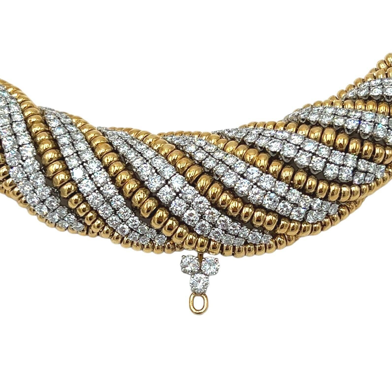  An 18 karat yellow gold, platinum and diamond necklace, David Webb.  Designed in a tapering trompe l’oeil twist style in gold, with every other strand of the twist enhanced with multiple platinum set round brilliant cut diamonds, totaling
