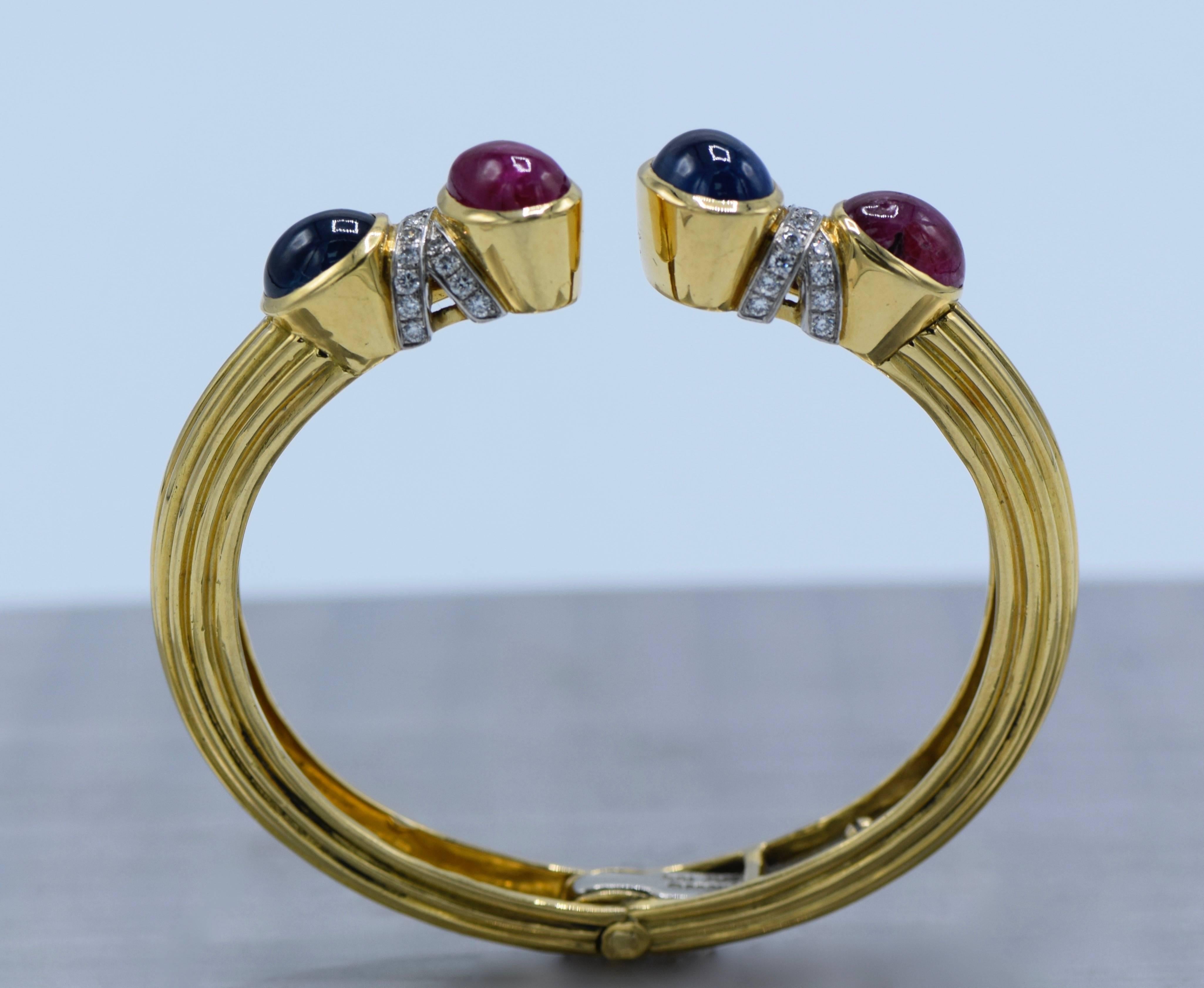 18 kt., 4 oval cabochon rubies & sapphires, 38 round diamonds ap. 1.00 ct., signed Webb, ap. 31.6 dwts. Inner cir. 6 3/16 inches. 

Cabochon rubies: deep pinkish-red, included, visible to eye, several surface-reaching inclusions & cavity, good