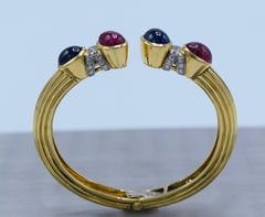 David Webb Gold, Platinum, Cabochon Ruby, Sapphire and Diamond Bangle Bracelet