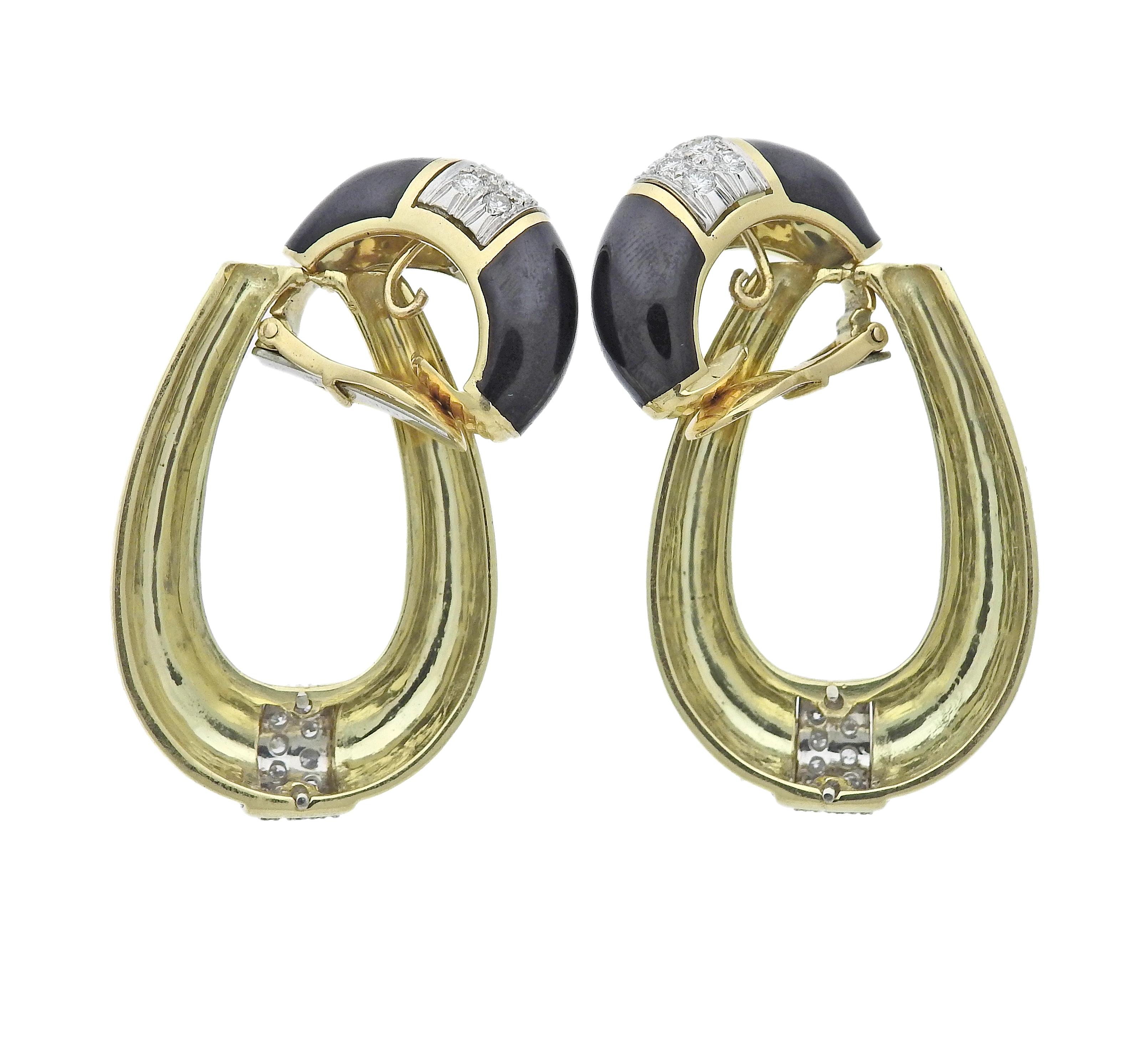 David Webb 18k gold and platinum doorknocker earrings set with approx. 1.00ctw in VS/H diamonds and black enamel. Earrings measure 55mm long, top hoop is 25mm. Marked: Webb, 18K, Plat. Weight is 42.6 grams.