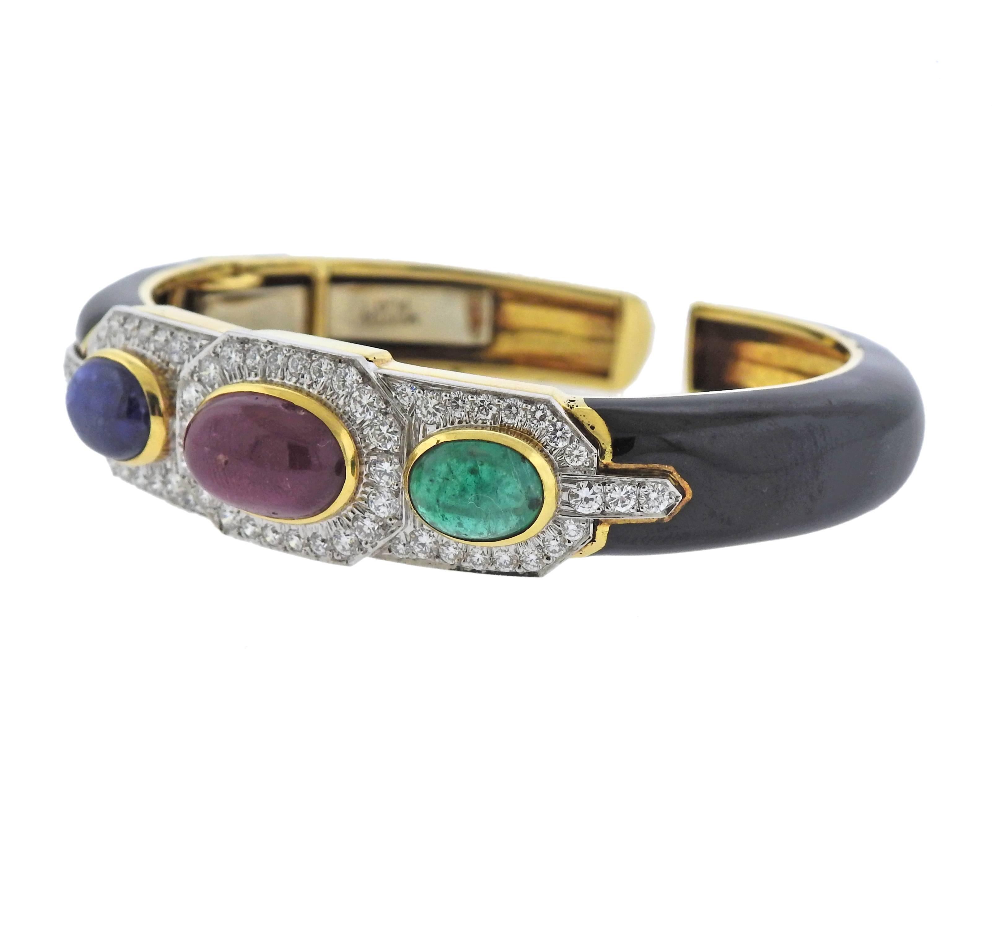 18k gold platinum bracelet crafted by David Webb featuring approximately 2.40ctw of H/VS diamonds, ruby, emerald, sapphire cabochons. Bracelet is will fit approx. 6.75