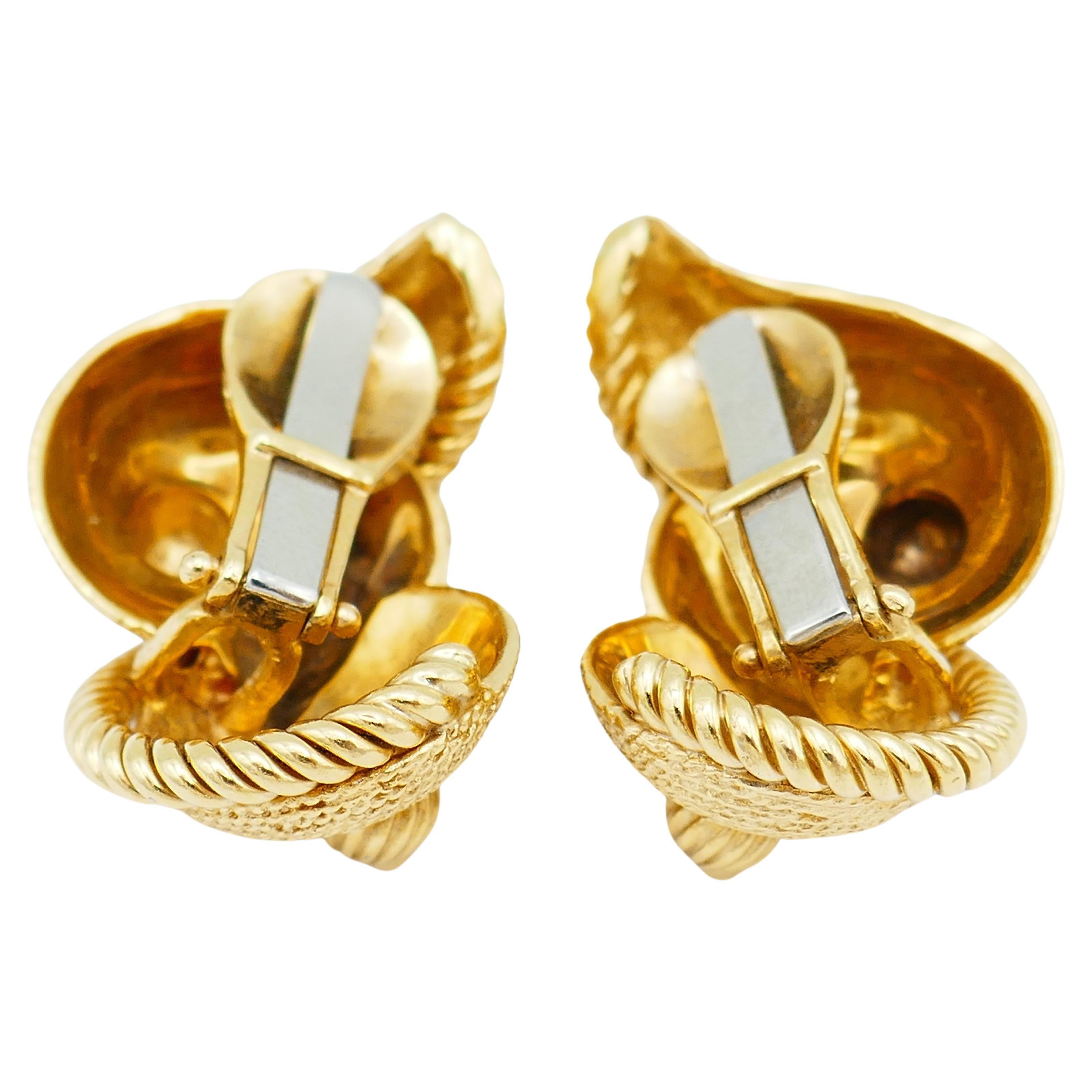 A great pair of David Webb gold earrings designed as sea shells.
Features amazing textured details making the earrings look very close to the natural shells. 
The earrings comprise of two swirl gold 