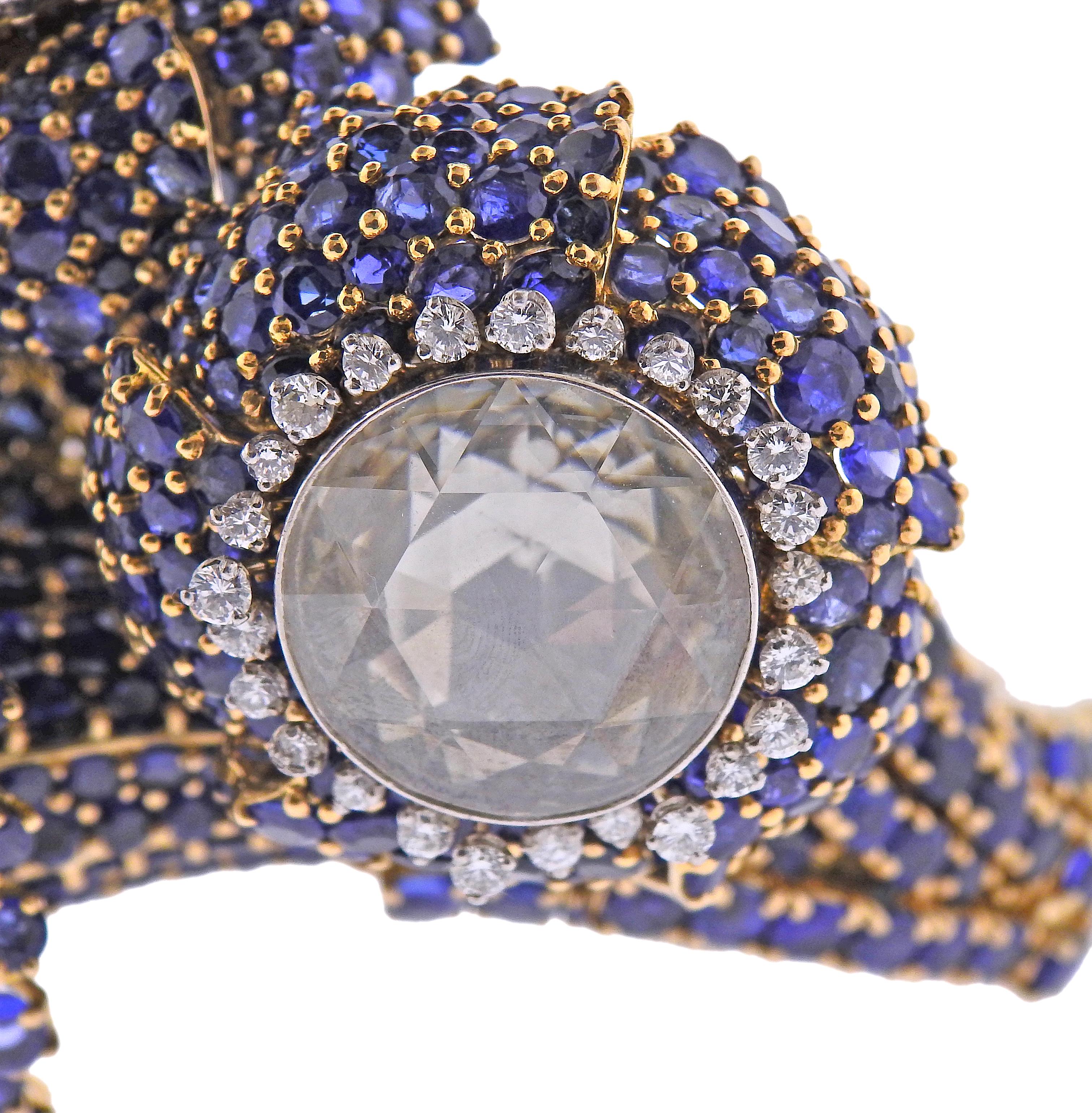 Gorgeous large 18k gold bangle bracelet by David Webb, with three rose cut diamonds - measuring 17.1mm ; 20.2mm and 18.5mm in diameter. Surrounded with vibrant blue sapphires and approx. 1.50ctw in round diamonds. Bracelet will fit average/medium