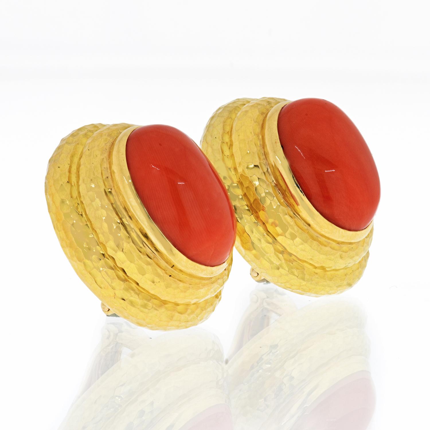 Yellow gold hammered coral clip on earrings that sit nice and tight on the ear. With a comfortable rubber softener to add extra support to the clip, you will feel like you have nothing on your ears. Best of all the gold and coral go so lovely