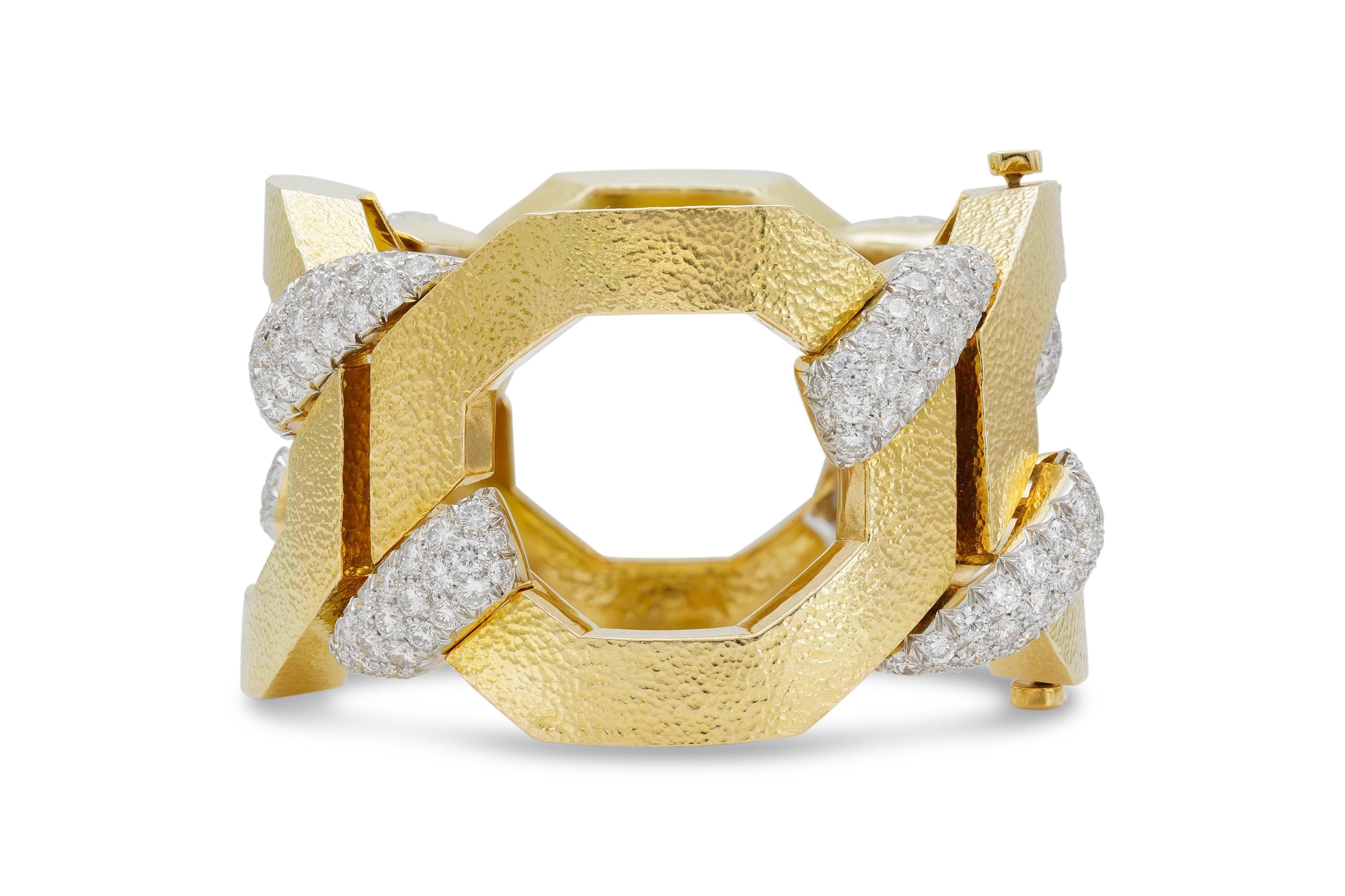 Finely crafted in 18K hammered yellow gold featuring round brilliant cut diamonds weighing approximately 11.11 carats total. 
Size 6 1/2 inches.
Signed and numbered by David Webb.