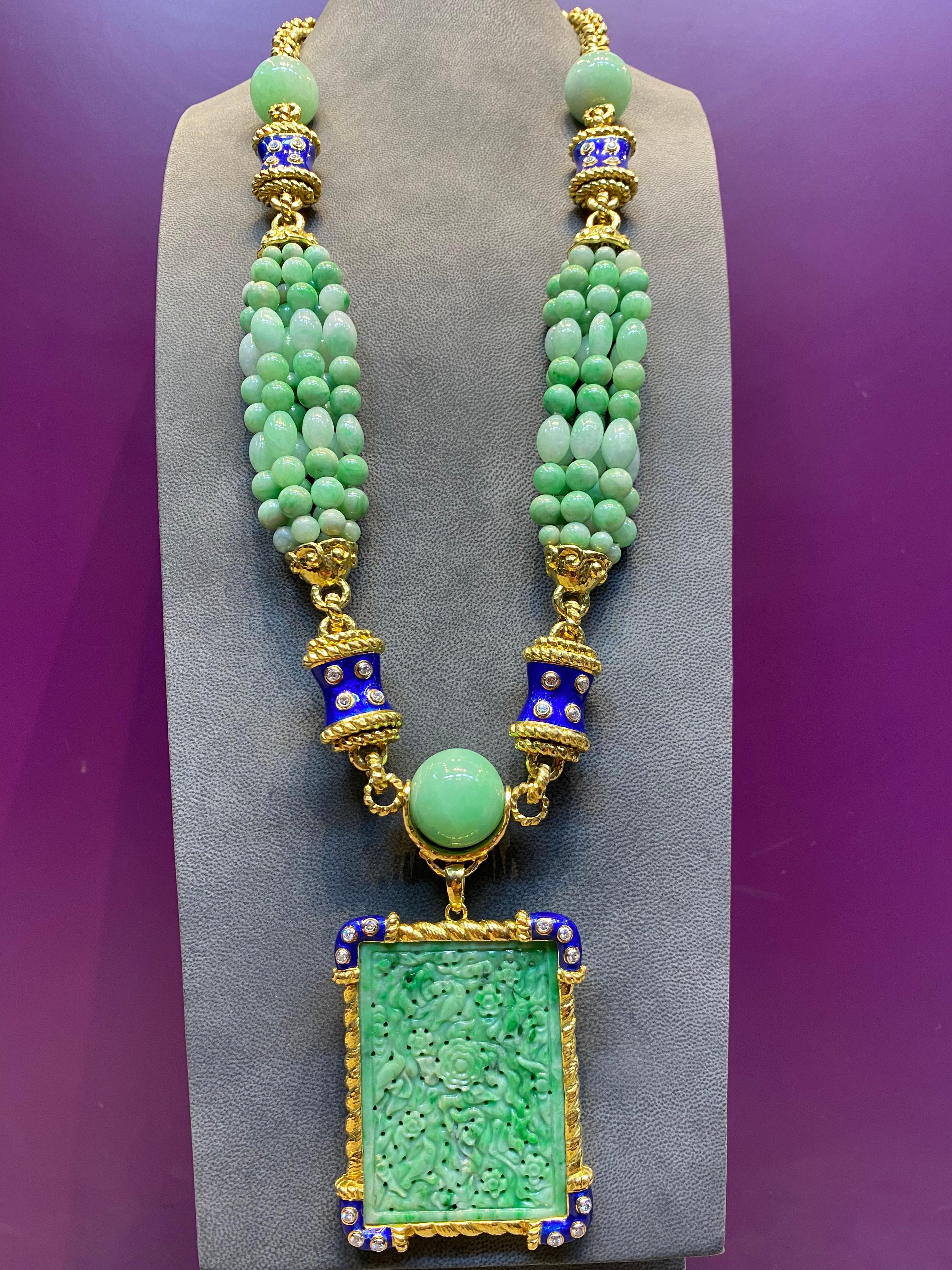 David Webb Jade, Diamond & Enamel Necklace set in 18K Yellow Gold & Platinum with detachable rectangular Jade pendant to be worn two ways. Six strands of jade beads & 3 larger beads attached to a 18k rope & blue enamel link.
Necklace Length: