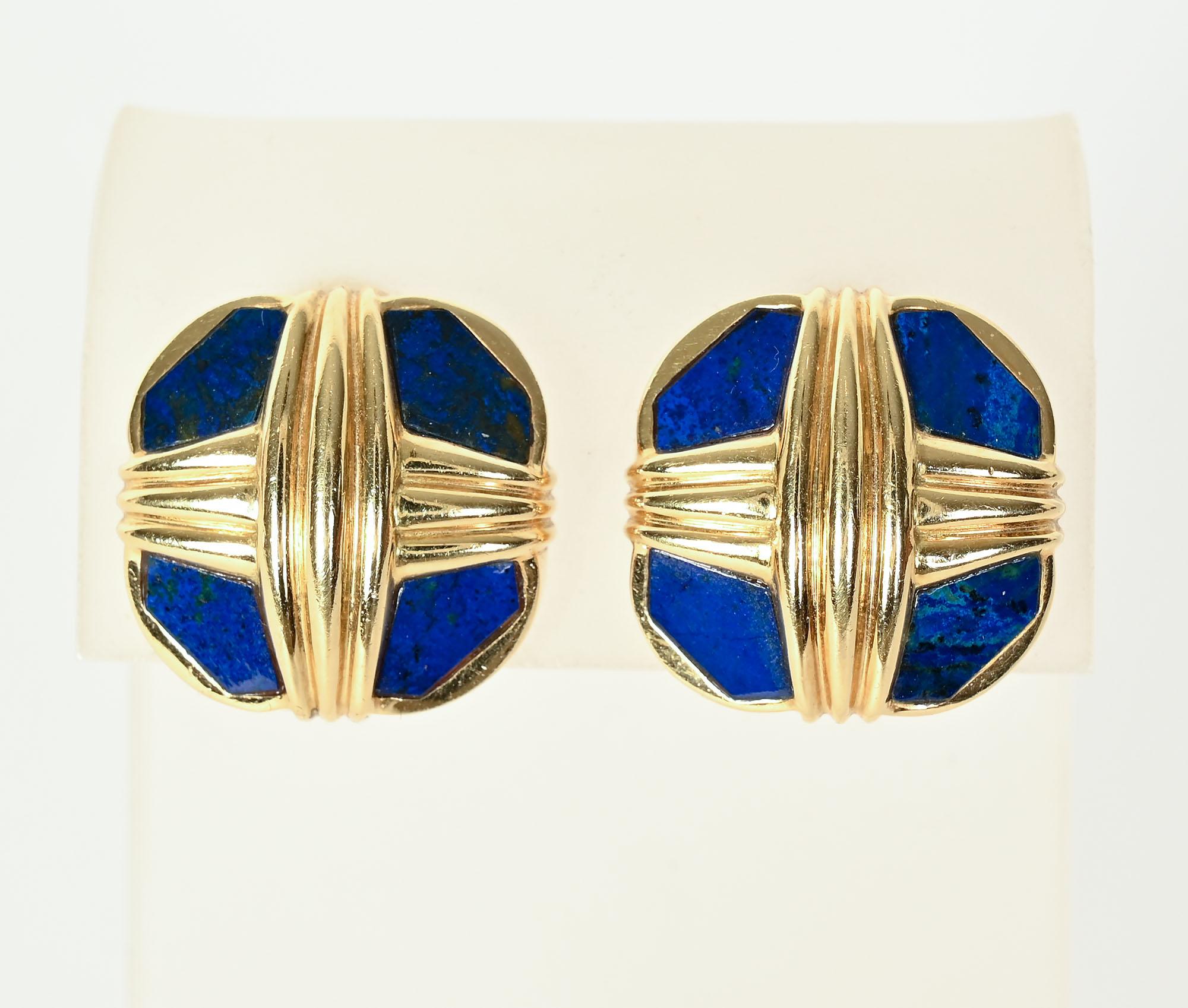 Sporty and chic colorful earrings by David Webb. The earrings are octagonal in shape with criss cross banding over the lapis lazuli. The earrings have clip backs that can be converted to posts.