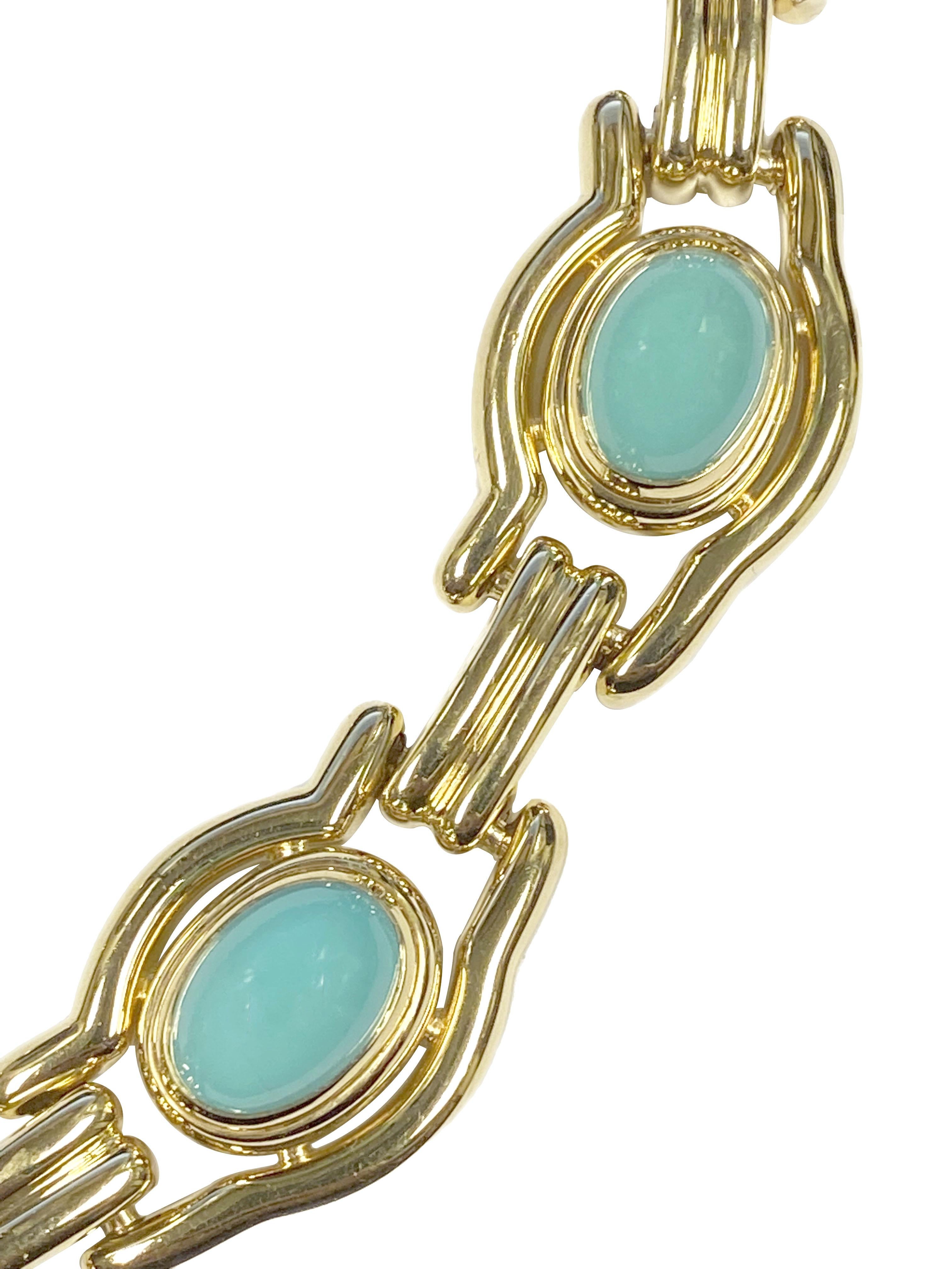 Circa 1990 David Webb 18K Yellow Gold Necklace measuring 16 inches in length and 3/4 inch wide, each 1 1/4 inch section is bezel set with a Fine color Persian Turquoise measuring from 14 X 10 M.M. to 10 X 9 M.M. nice solid construction and weighing
