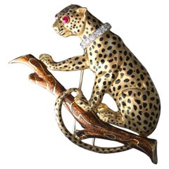 David Webb Leopard 18ct yellow gold enamel, Rubies and Diamond Brooch