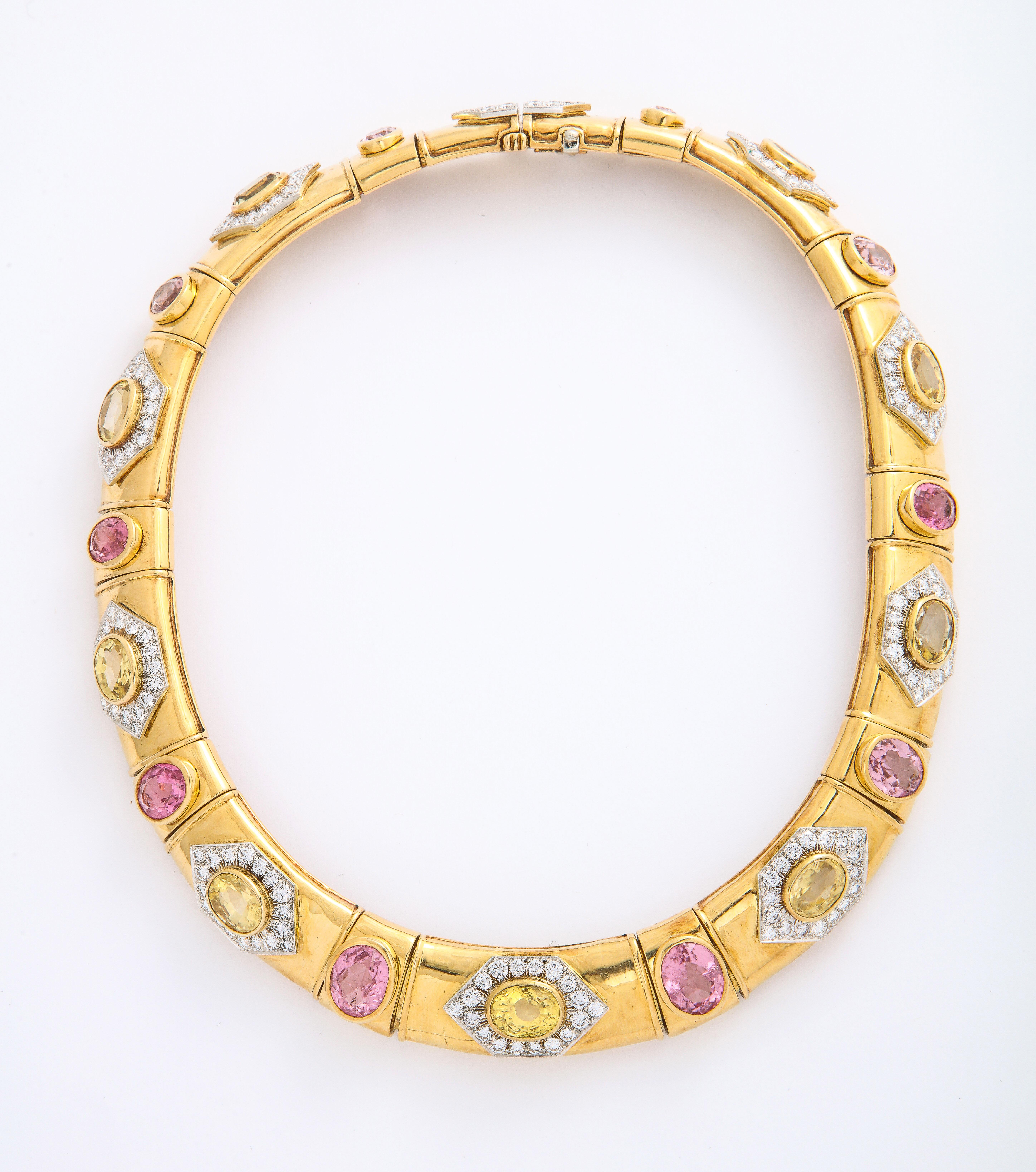 Created circa 1980, this magnificent Collar and Earrings set by David Webb is made in 18K Yellow Gold, adorned with multiple sapphires, citrines and pink tourmalines, and 20.0 cts tw of fine white full-cut diamonds. It is marked 18k PL