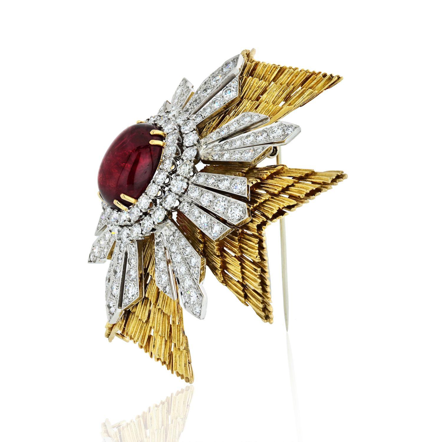 Designed as a textured gold Maltese cross, centering a cabochon ruby, accented by 164 round brilliant cut diamonds. Can be worn as a pendant and a brooch. Heavy piece of an approx. 2.25 inches. 88gr.
