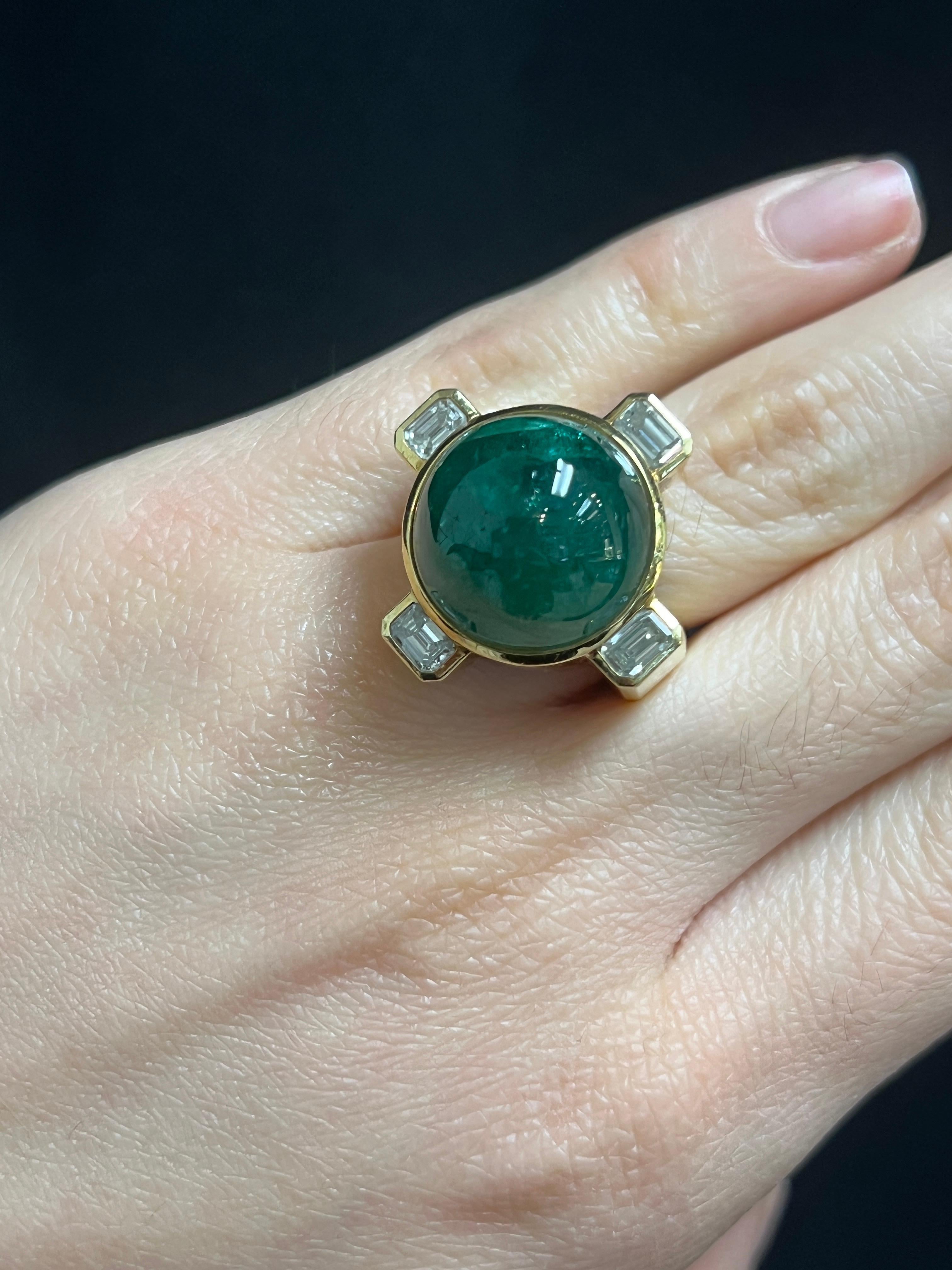 David Webb Men's Emerald and Diamond Ring 

A hammered gold ring featuring a large cabochon emerald at its center, accented by four emerald-cut diamonds.

Approximate Emerald Weight: 22.83 carats
Approximate Diamond Weight: 1.23 carats

With copy of
