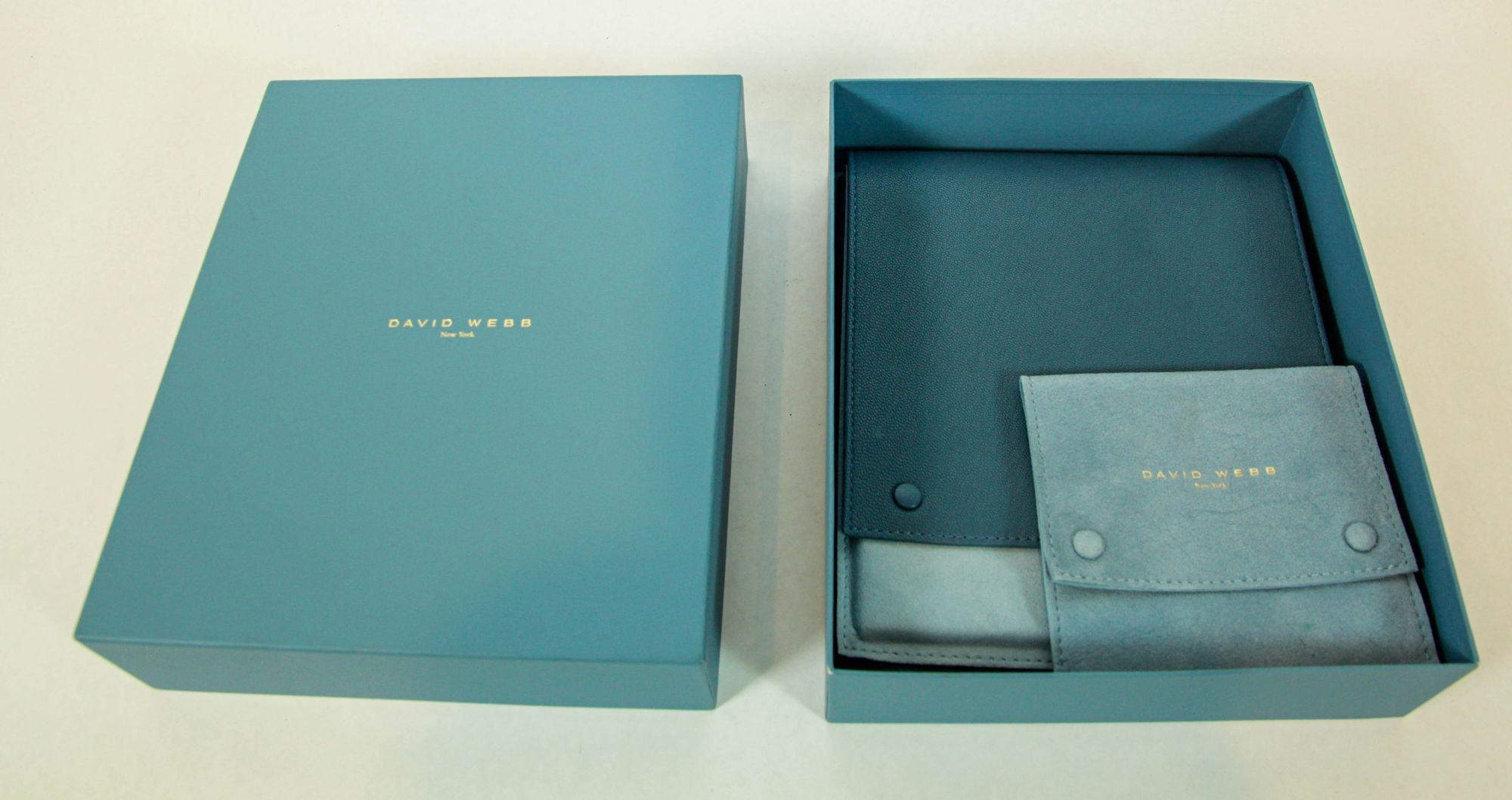 David Webb women's leather travel jewelry pouch for necklace and a smaller suede pouch with 2 separate sides for either earrings, bangle, brooch.
David Webb suede jewelry pouch. Light two tone blue leather and suede.
Crafted from supple blue leather