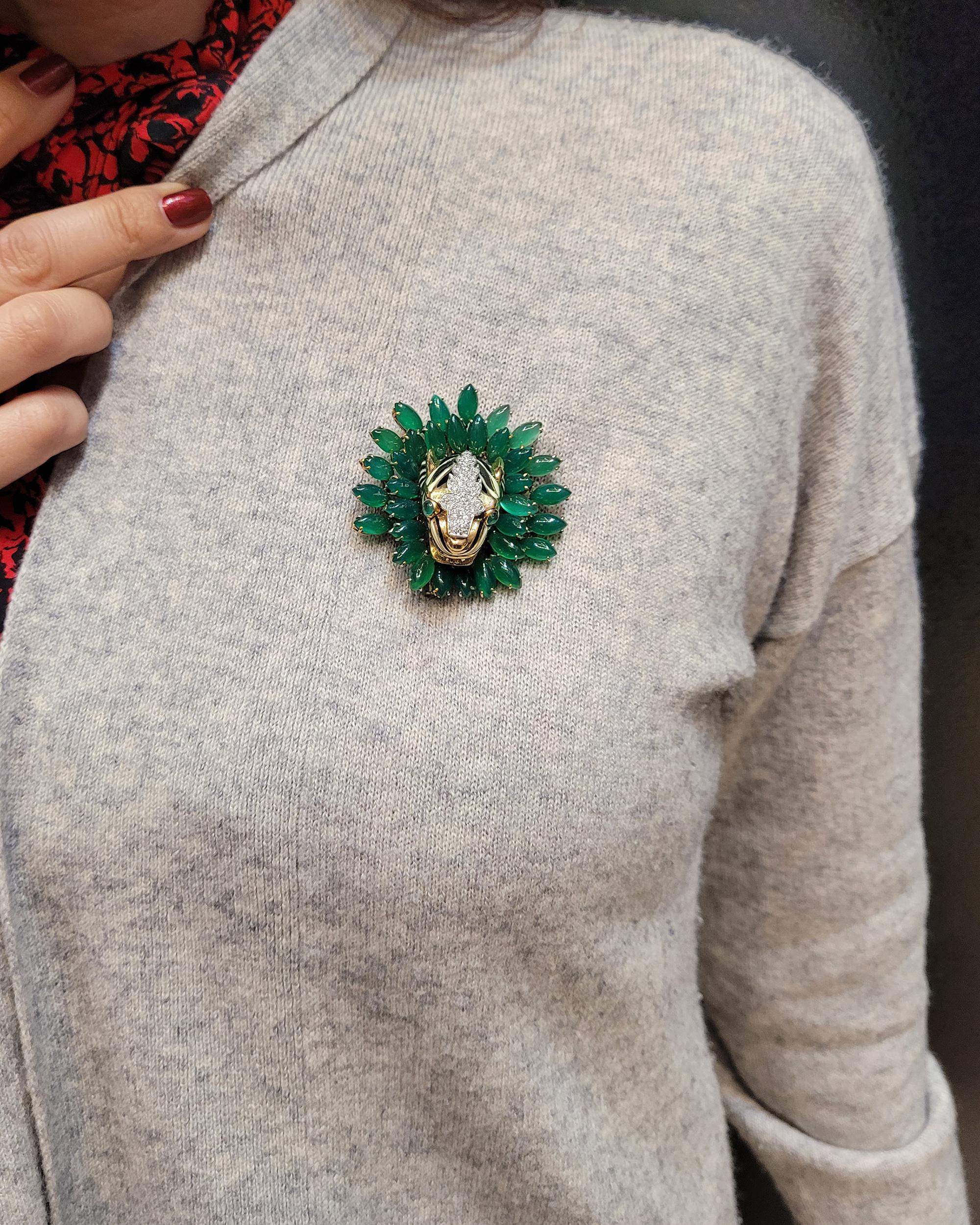 Stunning Tiger Head Brooch created by David Webb, featuring marquise green onyx, cabochon emeralds, approximately 0.99 carats of brilliant-cut diamonds, set in 18K yellow gold and platinum.
Signed David Webb.
Certificate of Authenticity is provided.

