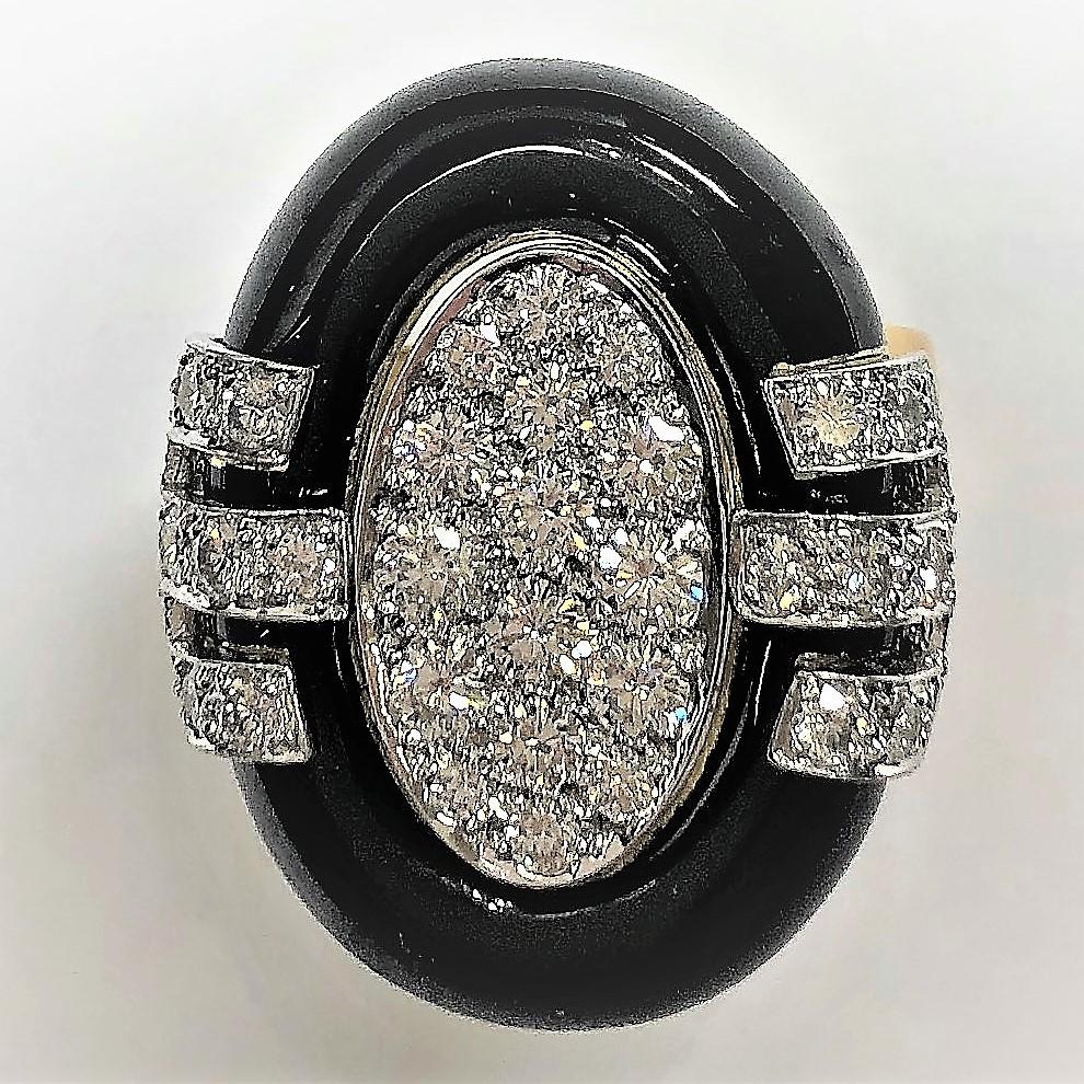Made of 18K Yellow Gold with black enamel, and with 40 Round Brilliant Cut Diamonds set into platinum plates, this tailored David Webb ring could be a welcome addition to your jewelry collection. The diamonds are of overall F Color and VS1 Clarity,