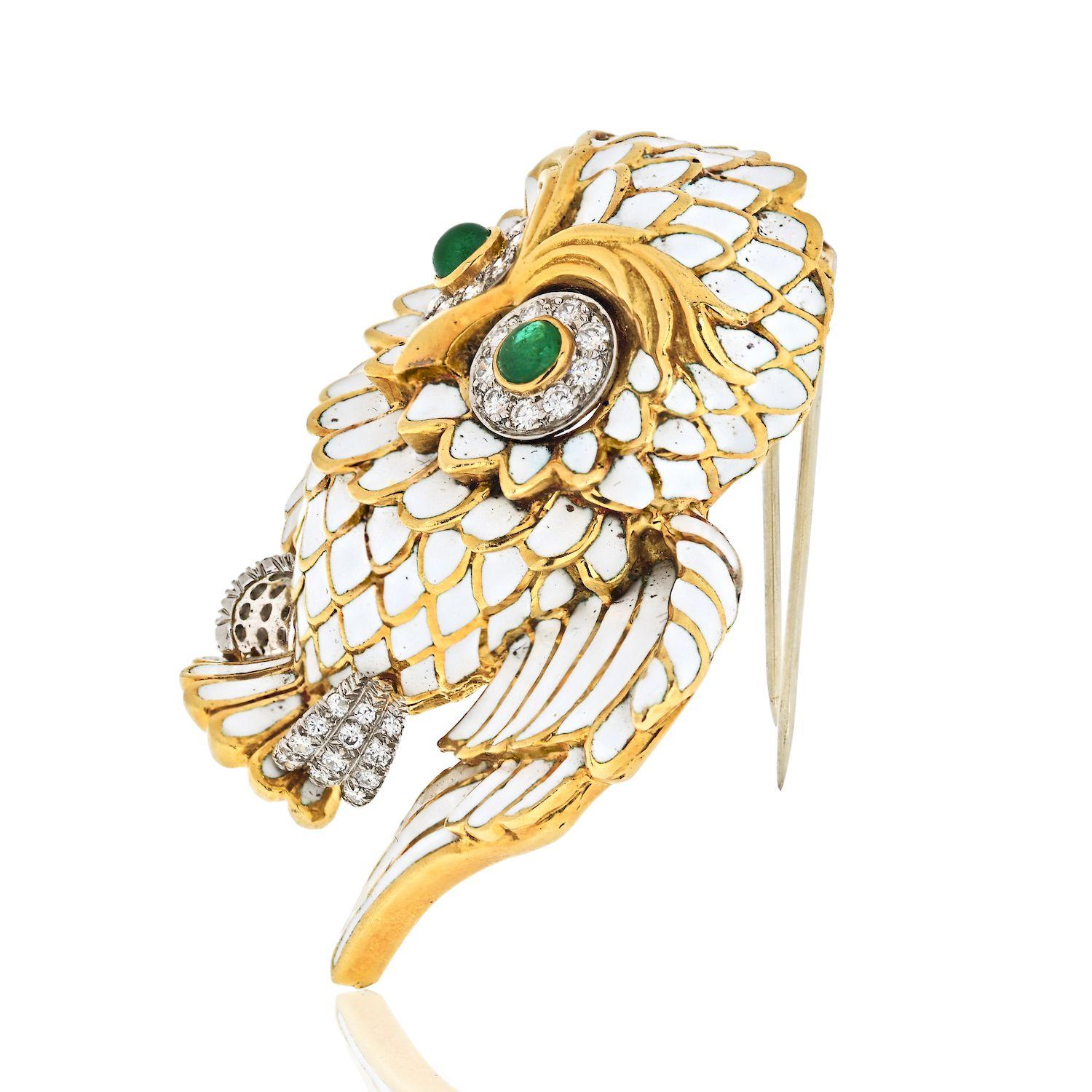 Fantastic owl brooch by David Webb made in 18K Yellow Gold, accented with green emerald eyes and diamonds. 

A David Webb owl brooch is somewhat delicate in the way they designed the wings. 

A very cute and even funny owl brooch, made in gold with