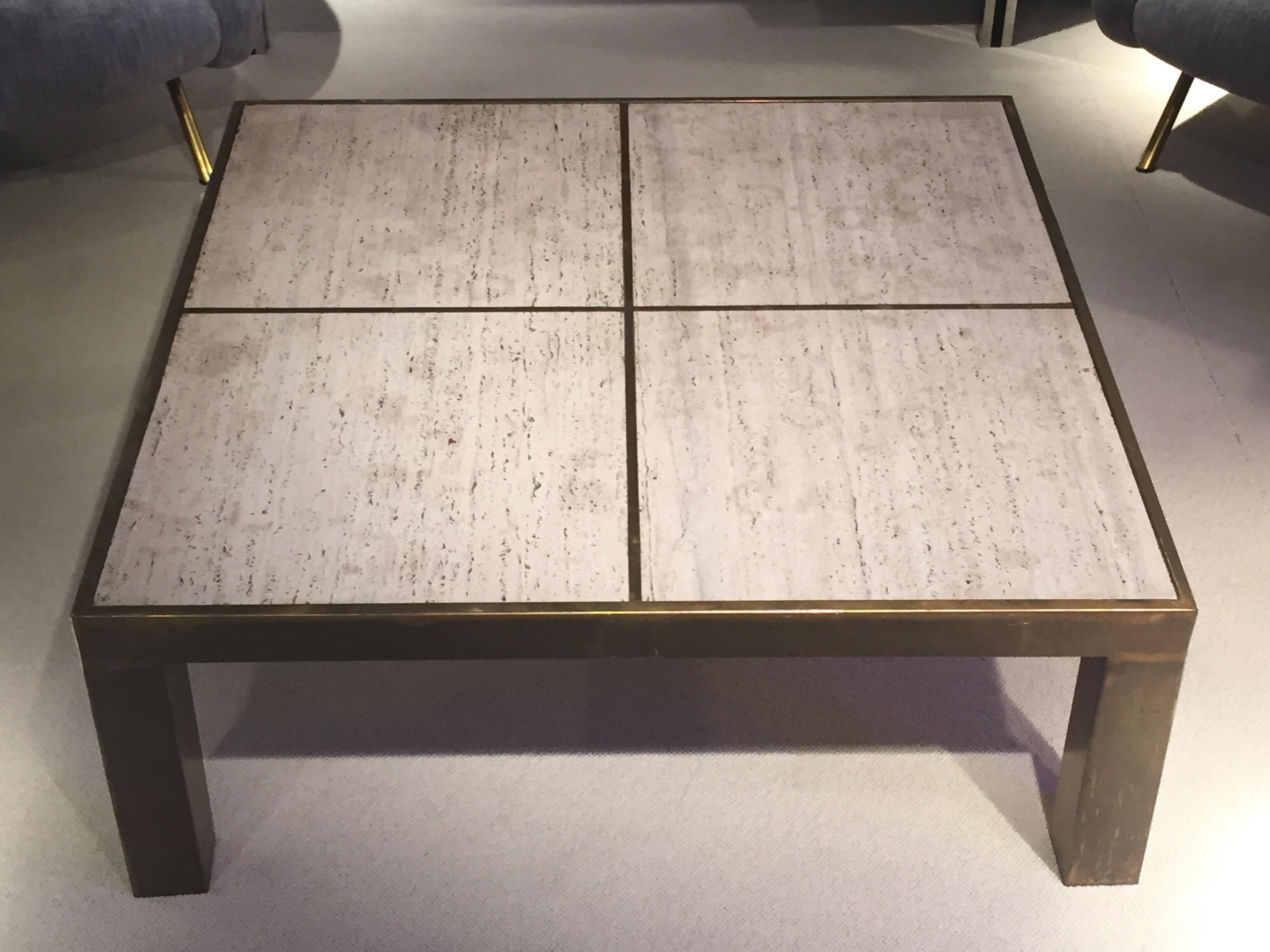 1970s brass coffee table and travertine top.
Marks on marble.