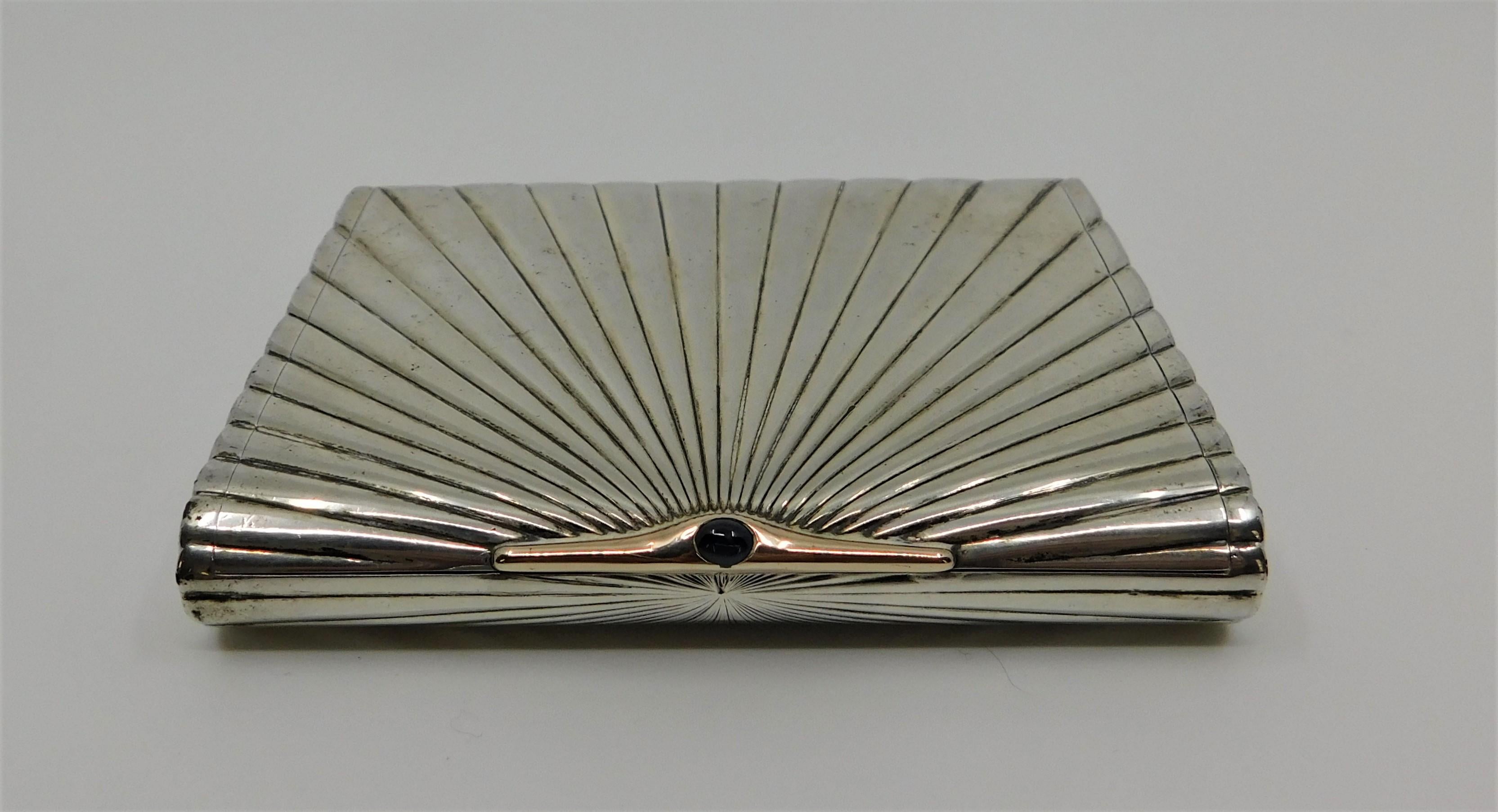 Very impressive Art Deco 830 grade silver case with gold and a sapphire jewel in-bedded. Maker S and S, inside presented in 1945.