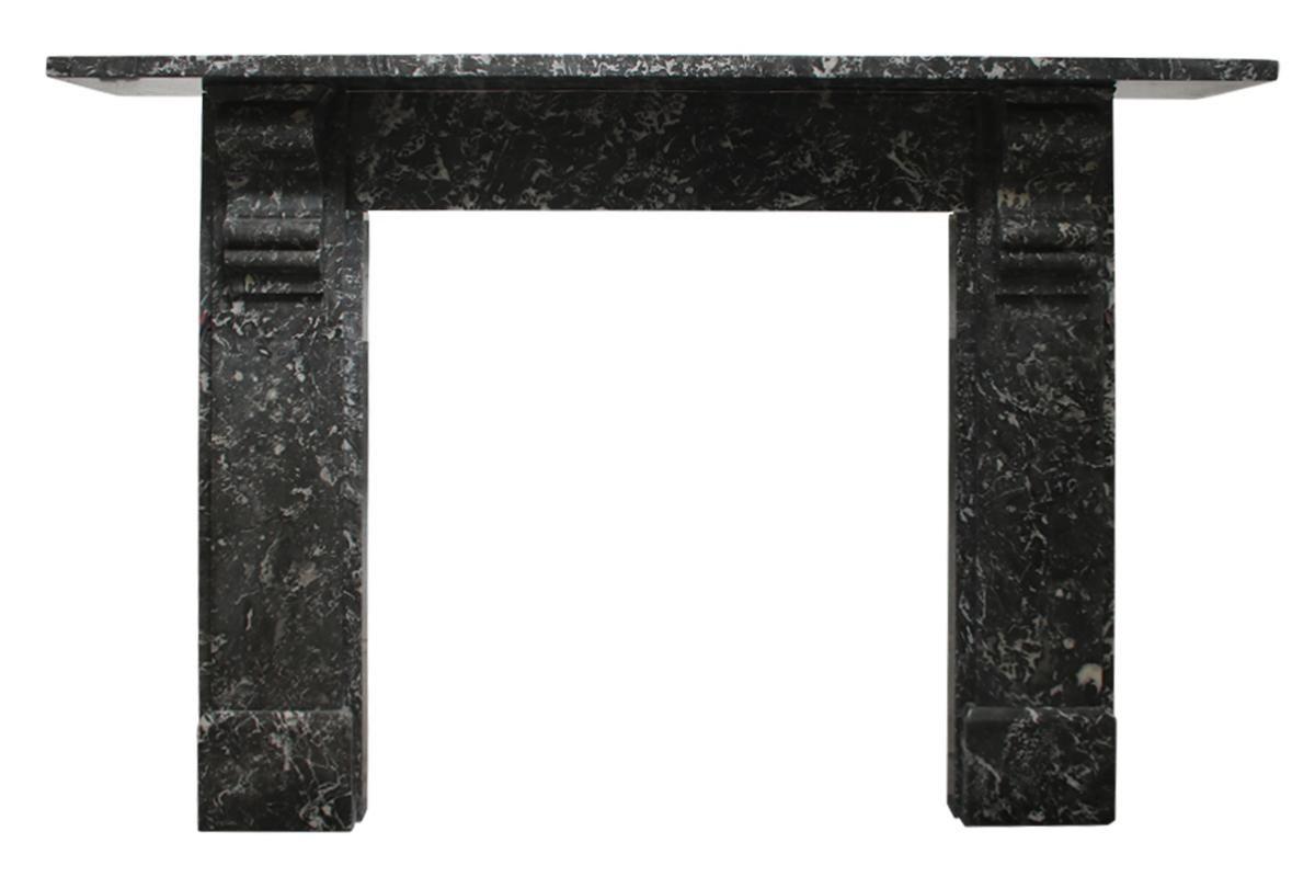 Late Victorian St Anne marble fire surround with simple but large corbels supporting the shelf, circa 1880.

Pictured with an original cast iron register grate. Sold separately.