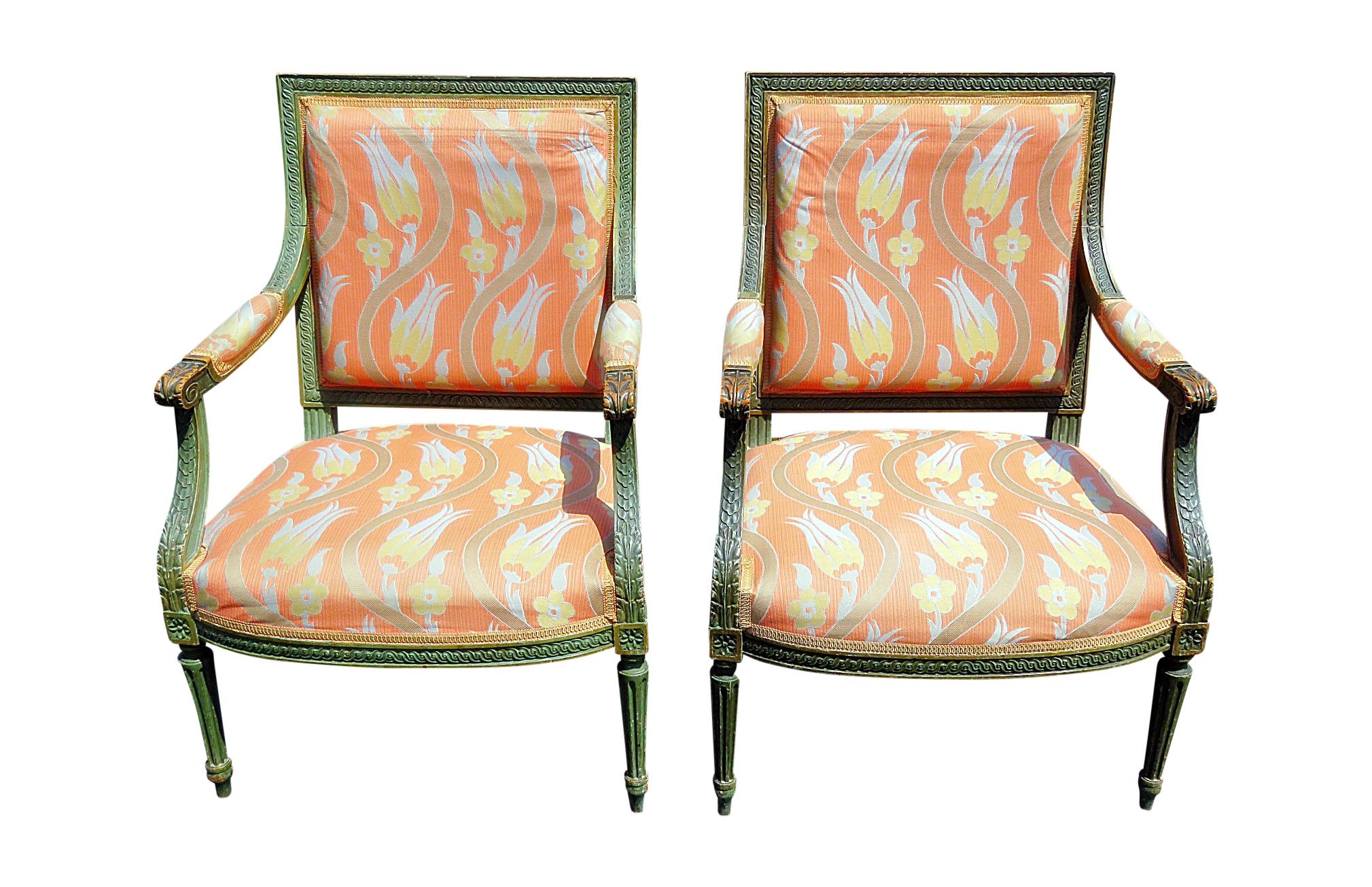 Pair of Louis XVI style distressed painted armchairs.