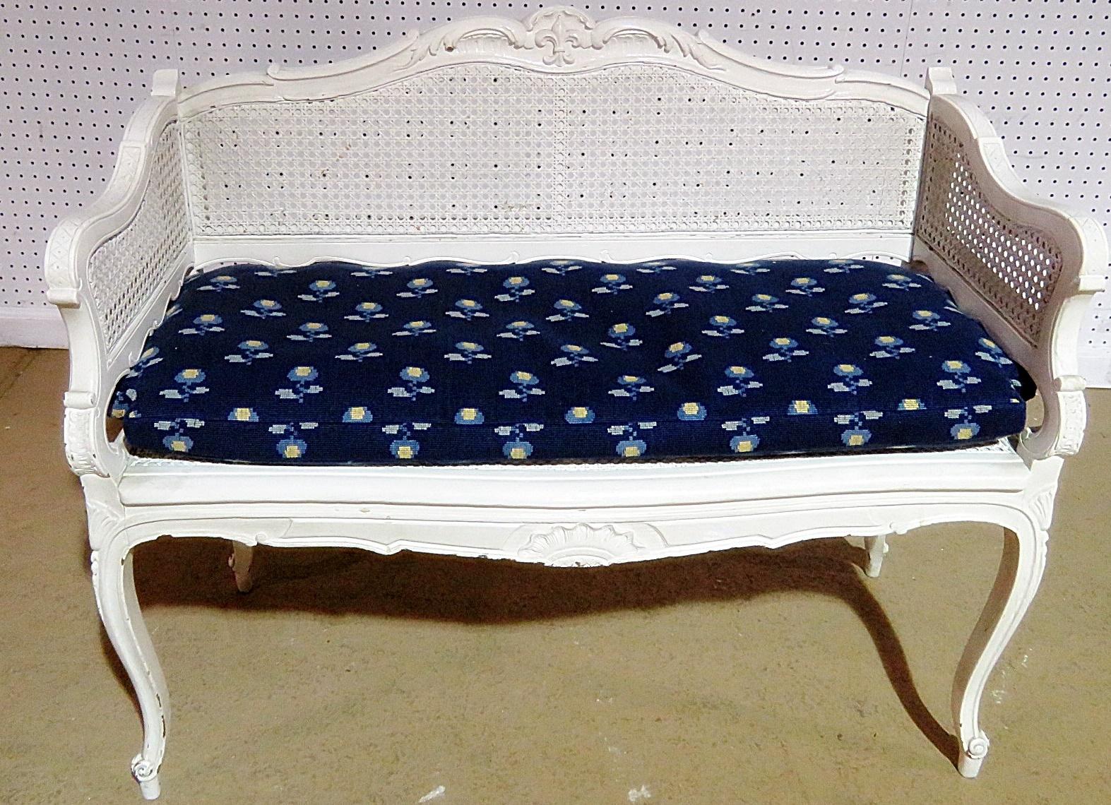 Swedish Louis XVI style caned settee with cushion.