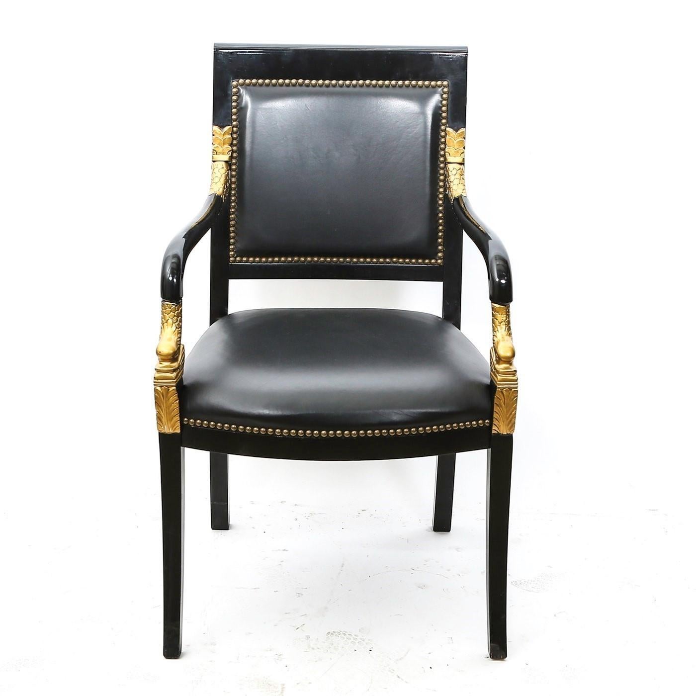 This lovely pair of Empire armchairs with rather majestic lines. Featuring frames made of mahogany wood professionally lacquered in black. Consists of a large flat or slightly curved upholstered backrest over an upholstered seat which is joined by